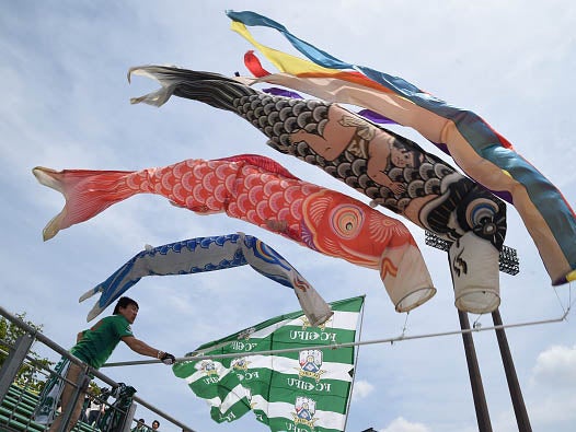 Children's day carp flags flying over a home in Kyoto