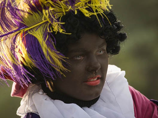 A woman dressed up in traditionally Zwarte Piet costume in Voorschoten, Netherlands