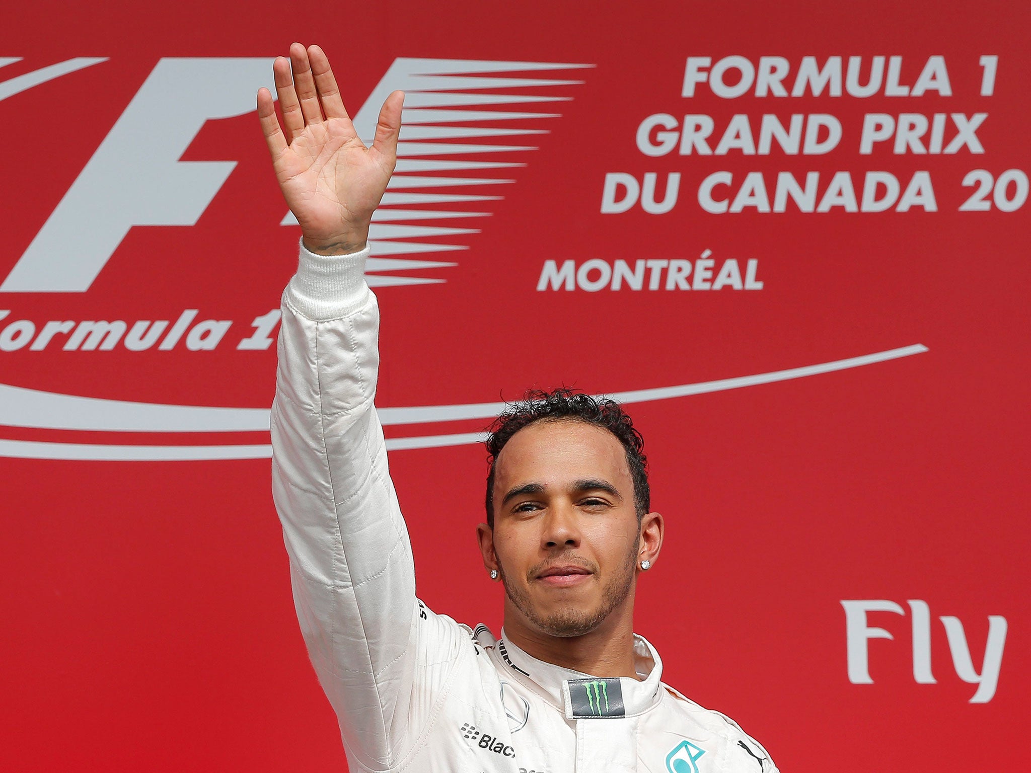 Lewis Hamilton of Mercedes AMG GP celebrates on the podium