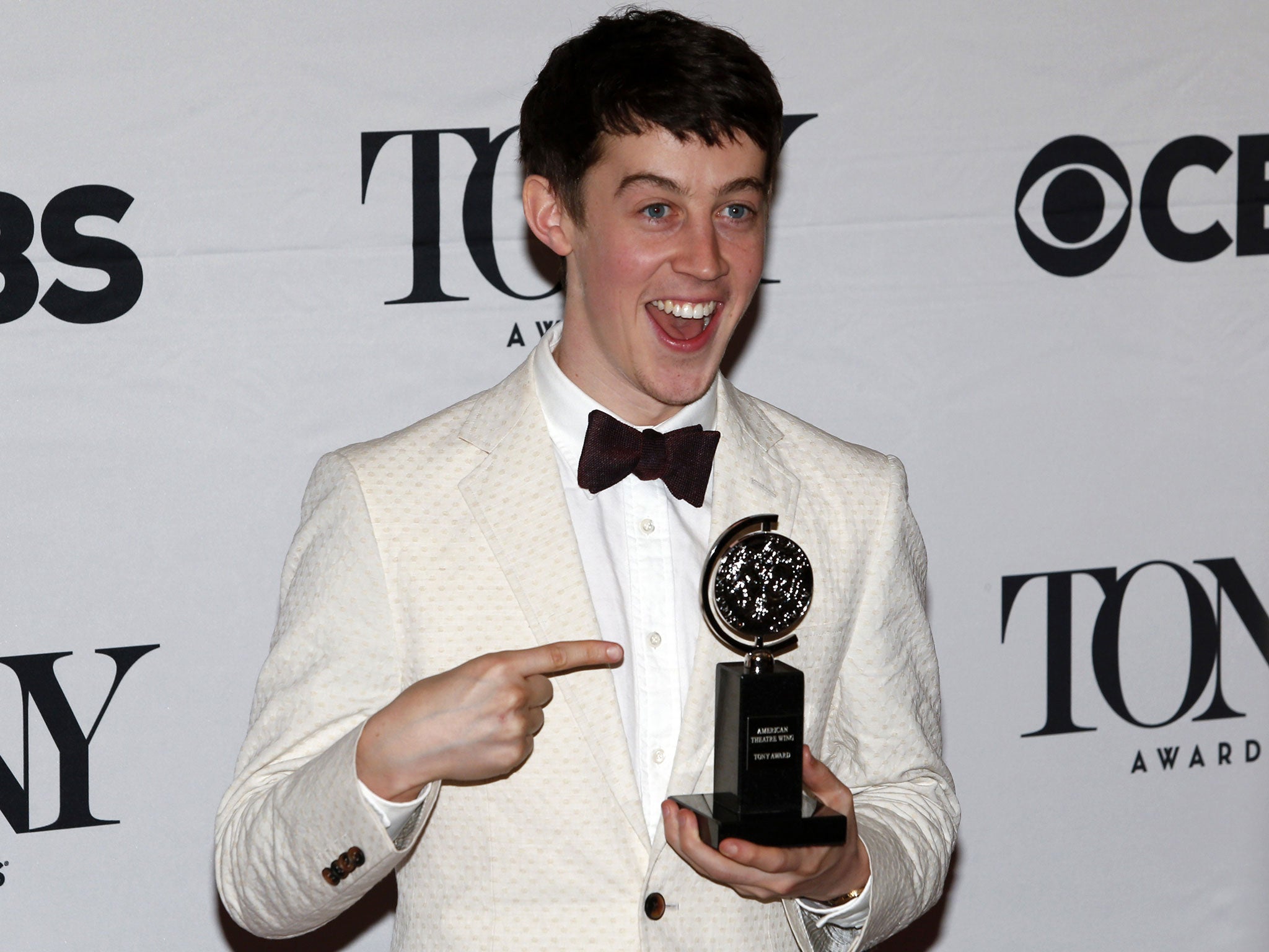 Alex Sharp with his award for Best Performance by an Actor in a Leading Role in a Play for 'The Curious Incident of the Dog in the Night-Time'