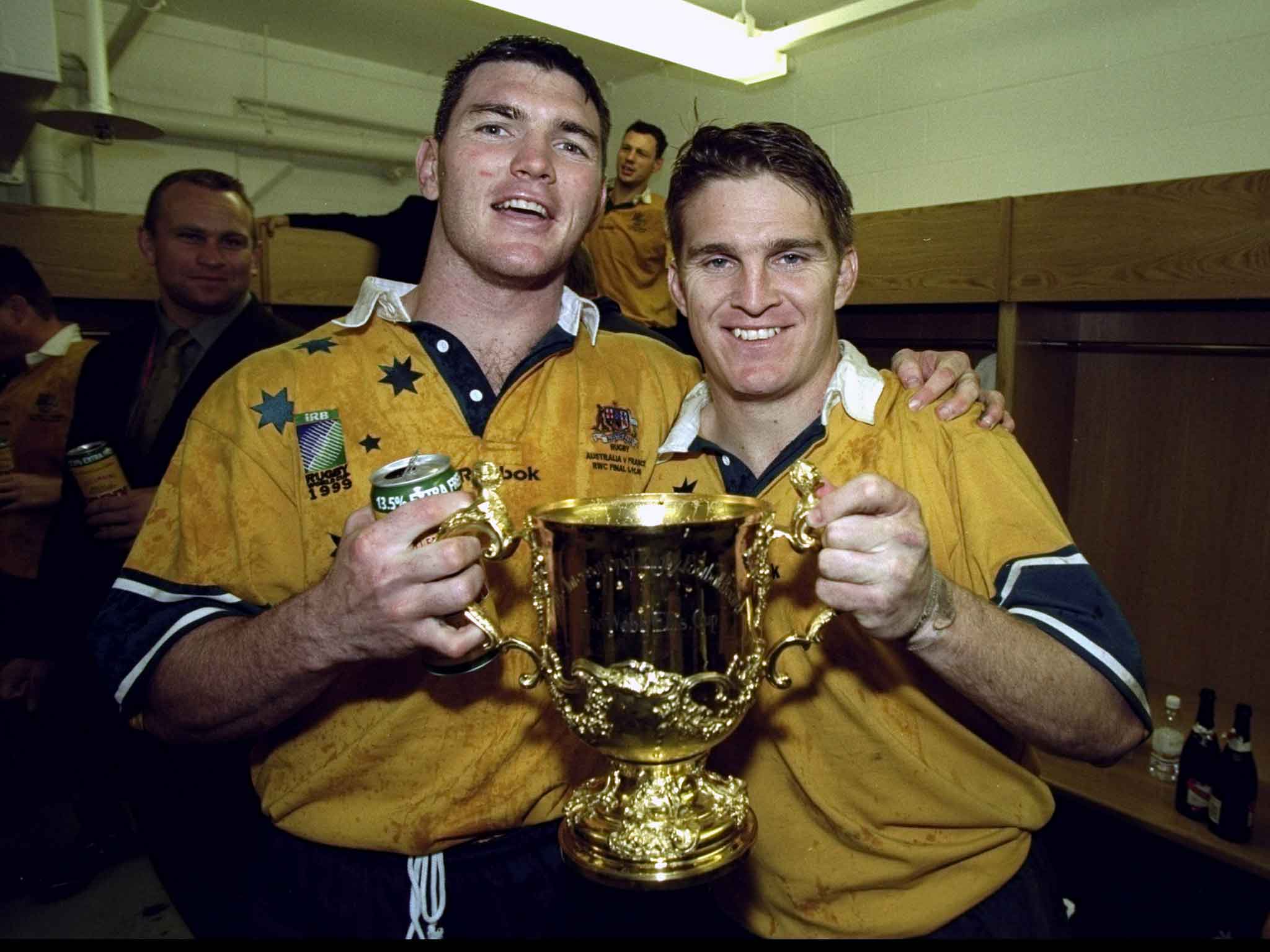 Daniel Herbert and Tim Horan (right) following the 1999 Rugby World Cup victory