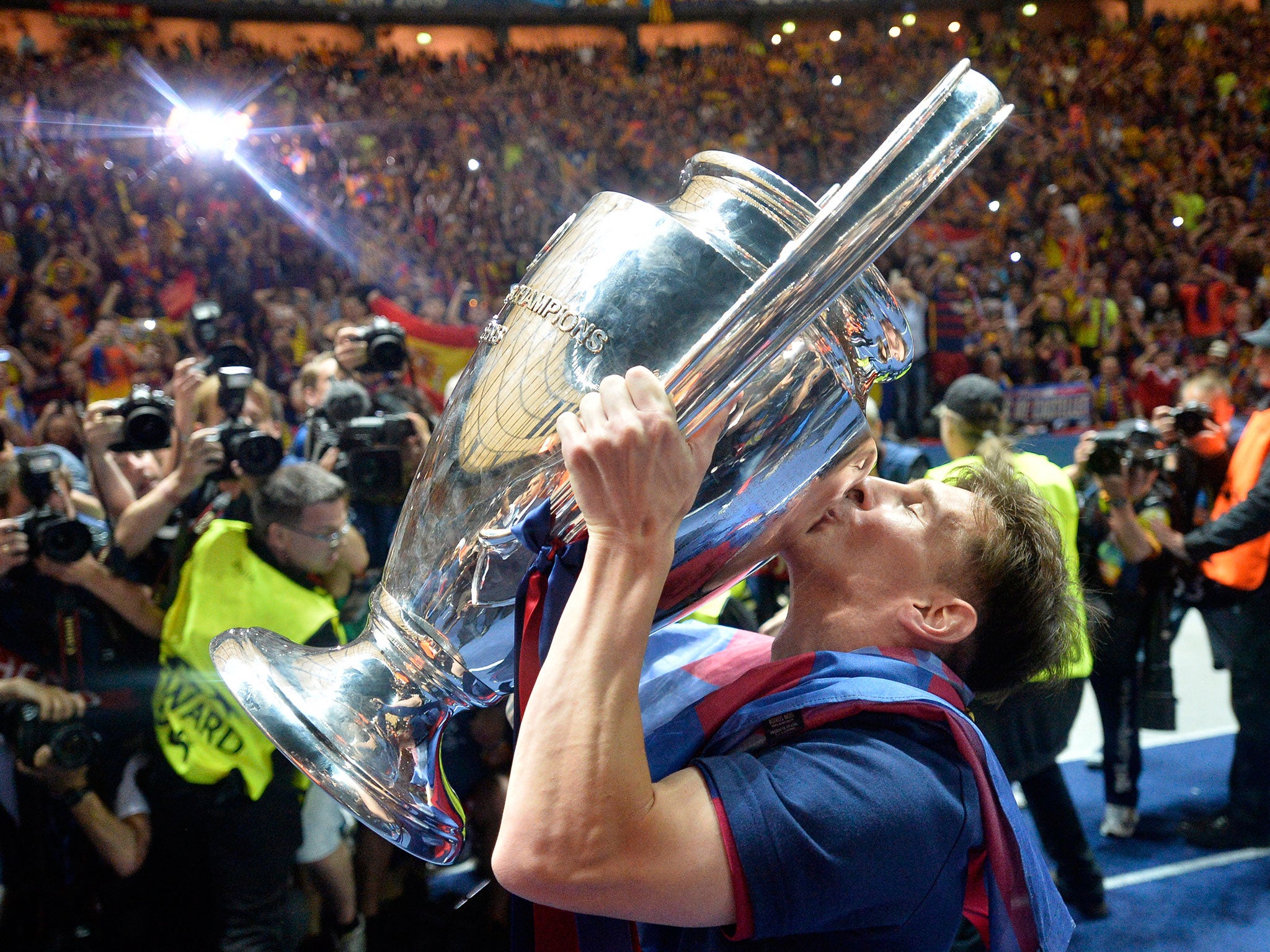 Barcelona's Lionel Messi kisses the Champions League trophy