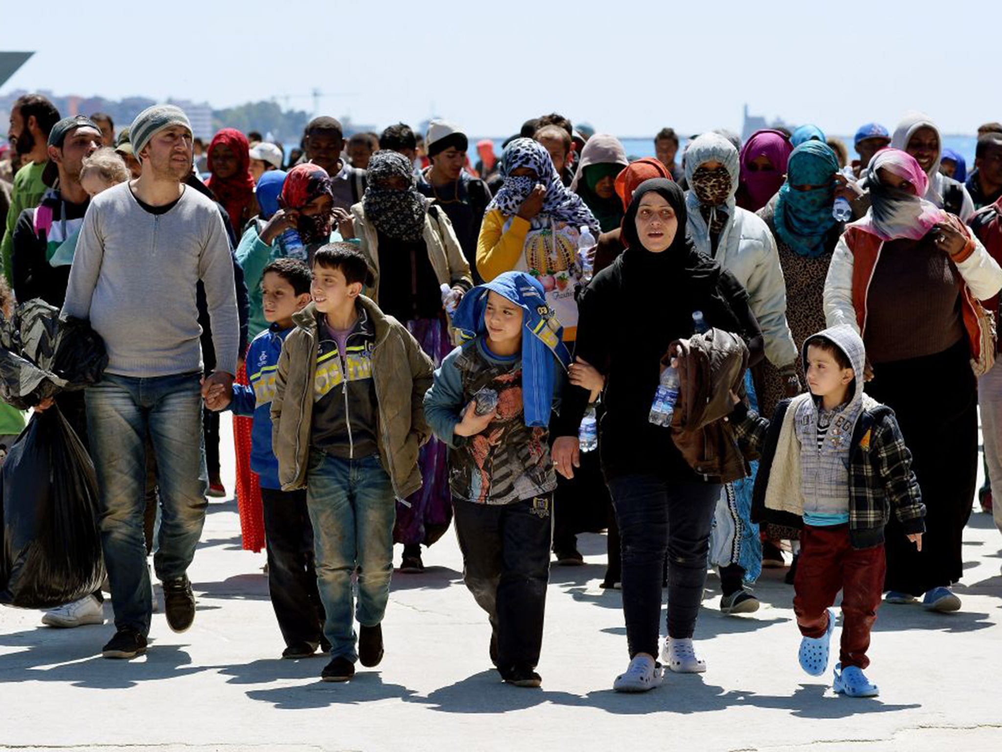 Rescued migrants disembarking in Sicily in April.