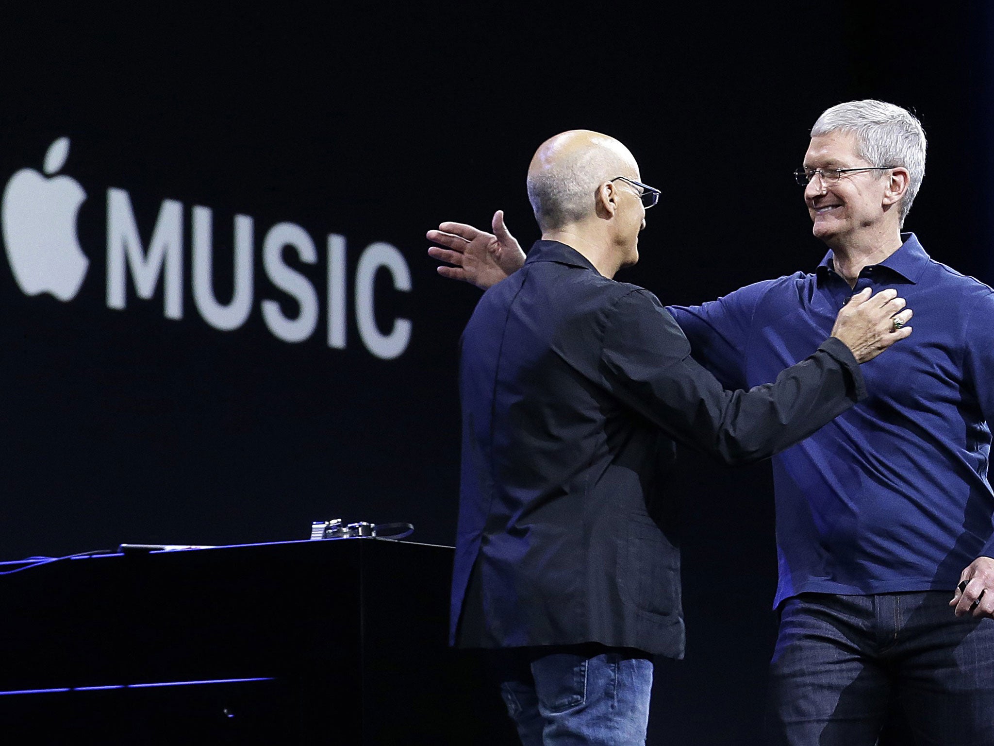 Apple CEO Tim Cook with Beats by Dre co-founder and Apple employee Jimmy Iovine at the Apple Worldwide Developers Conference in San Francisco, Monday, June 8, 2015