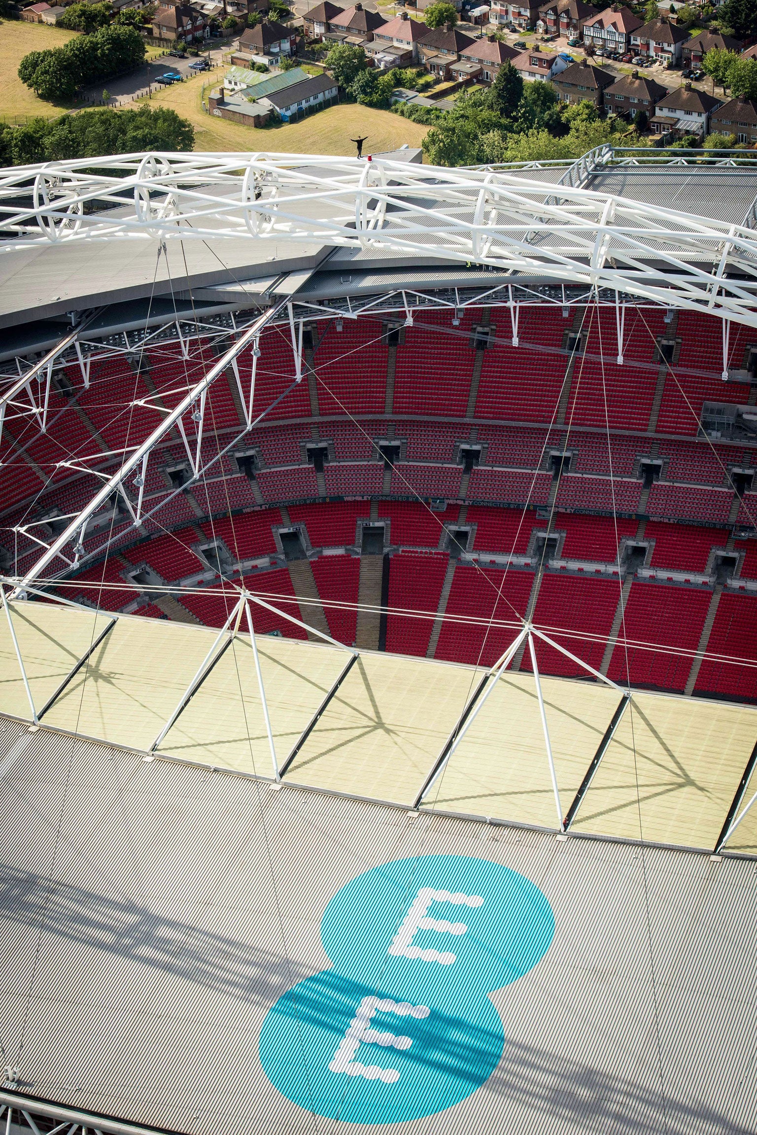 James Kingston stands on top of the Wembley Arch