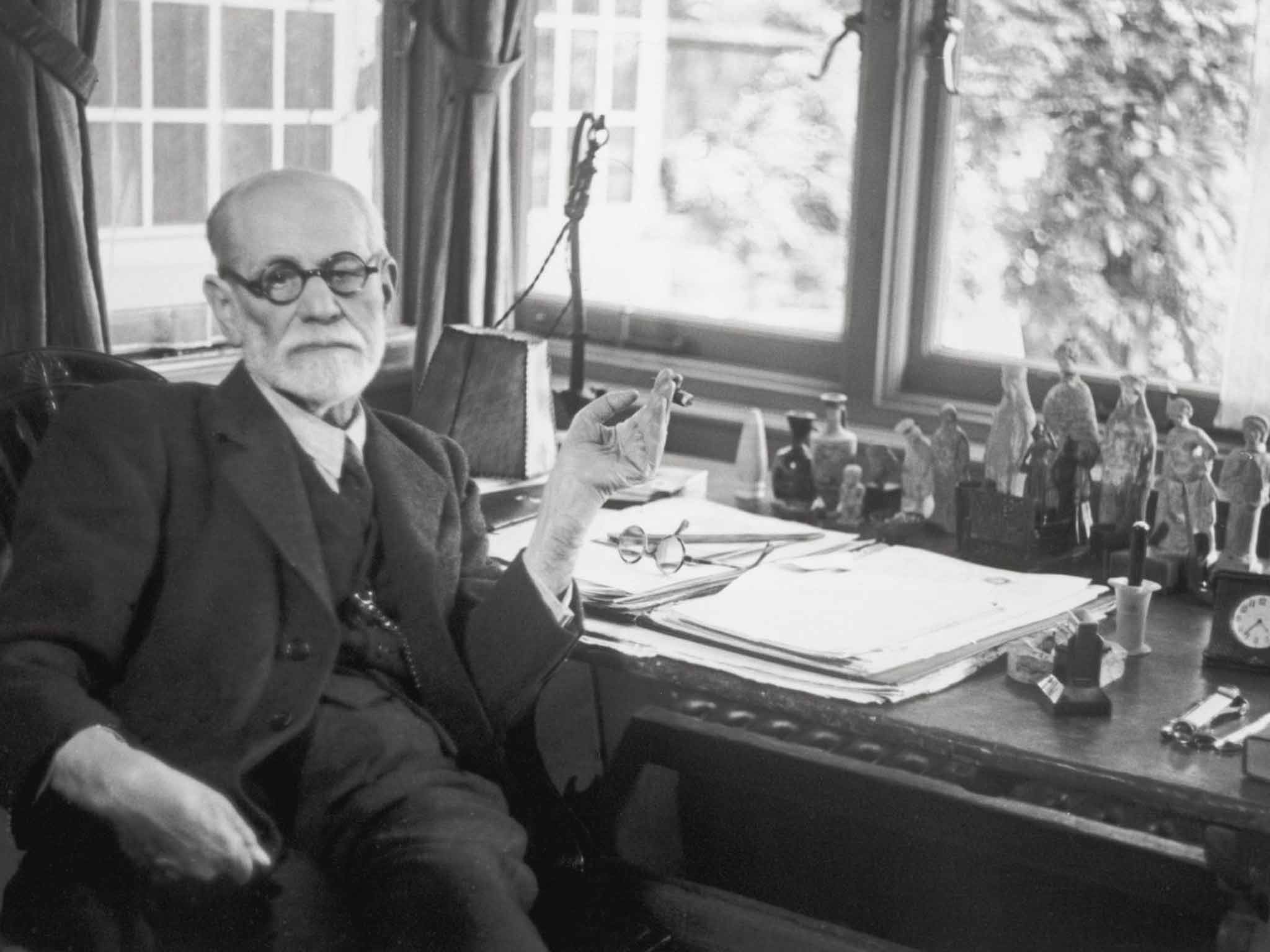 Sigmund Freud at his desk in London in 1938, with some of his extensive collection of nearly 3,000 items