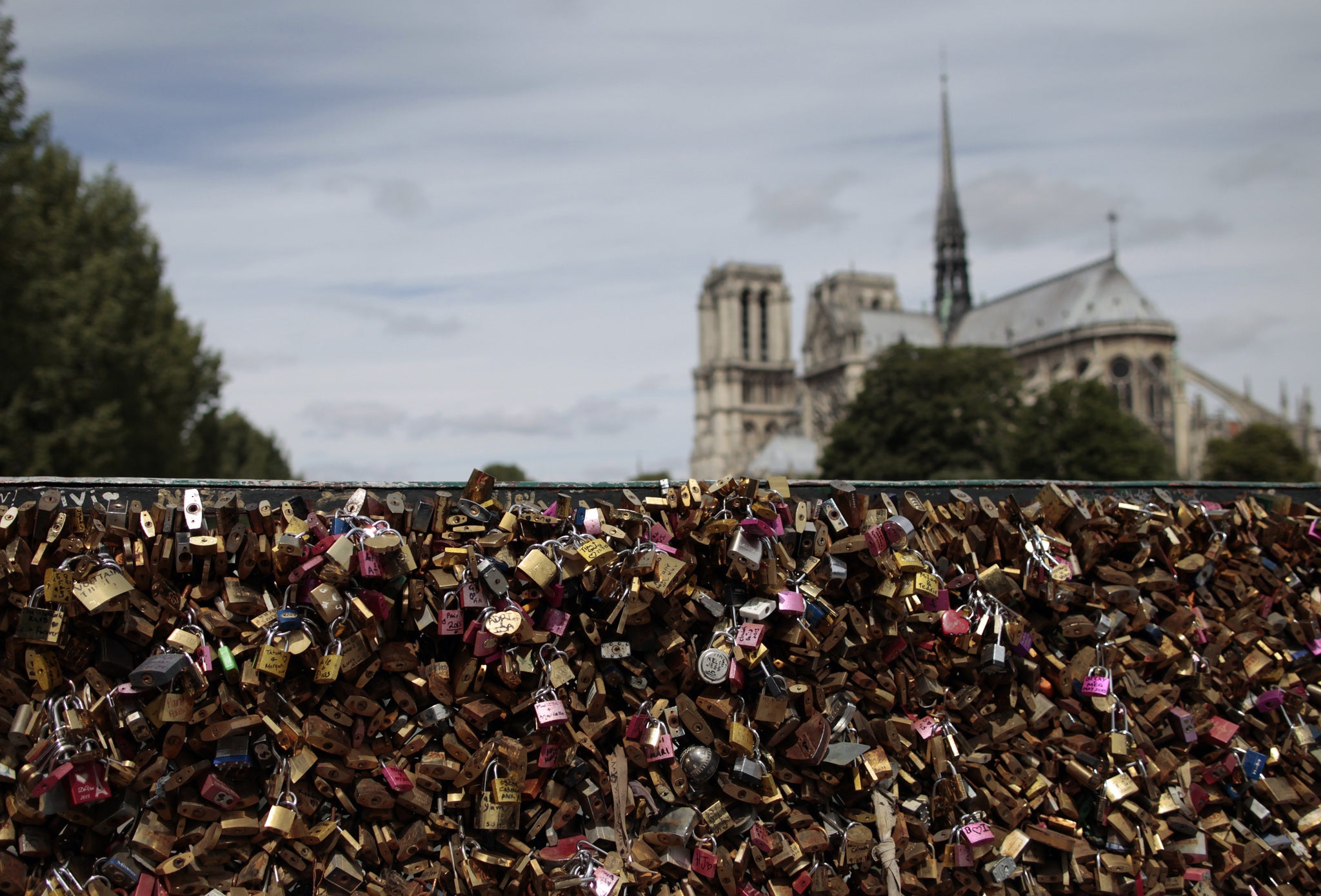 The love padlocks have become a romantic ritual for many couples visiting the French capital (Photo by CHARLY TRIBALLEAU/AFP/Getty Images)