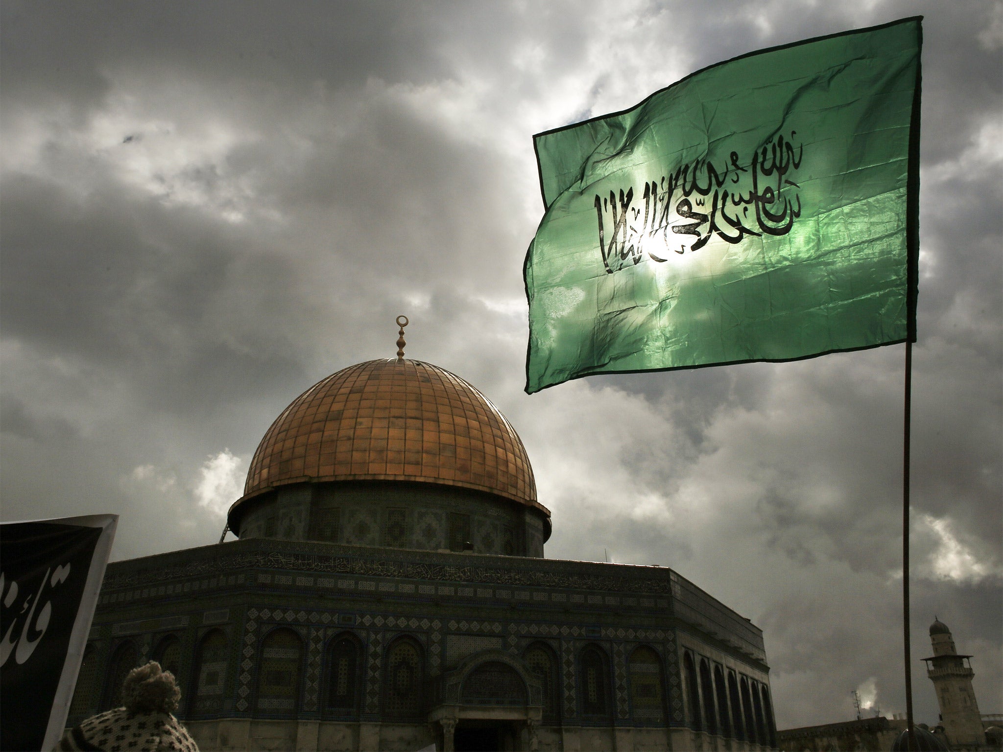 Hamas’s flag is paraded outside a mosque in Jerusalem (Getty)