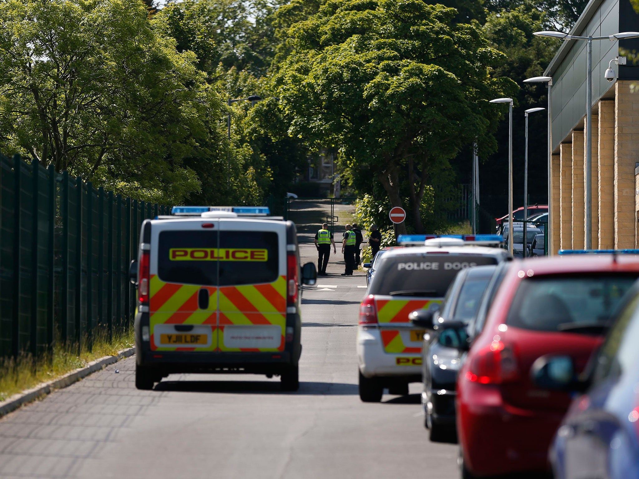 A 14-year-old boy is being hunted by police after a teacher was stabbed at the Dixons Kings Academy in Bradford