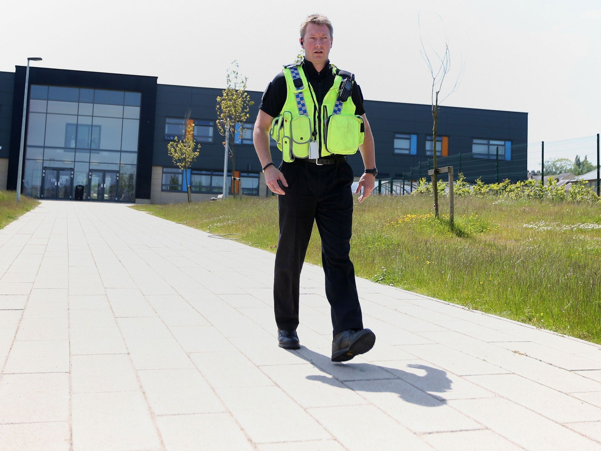 Police outside Dixons Kings Academy in Bradford, as a 14-year-old boy is being hunted by police after a teacher was stabbed at the school