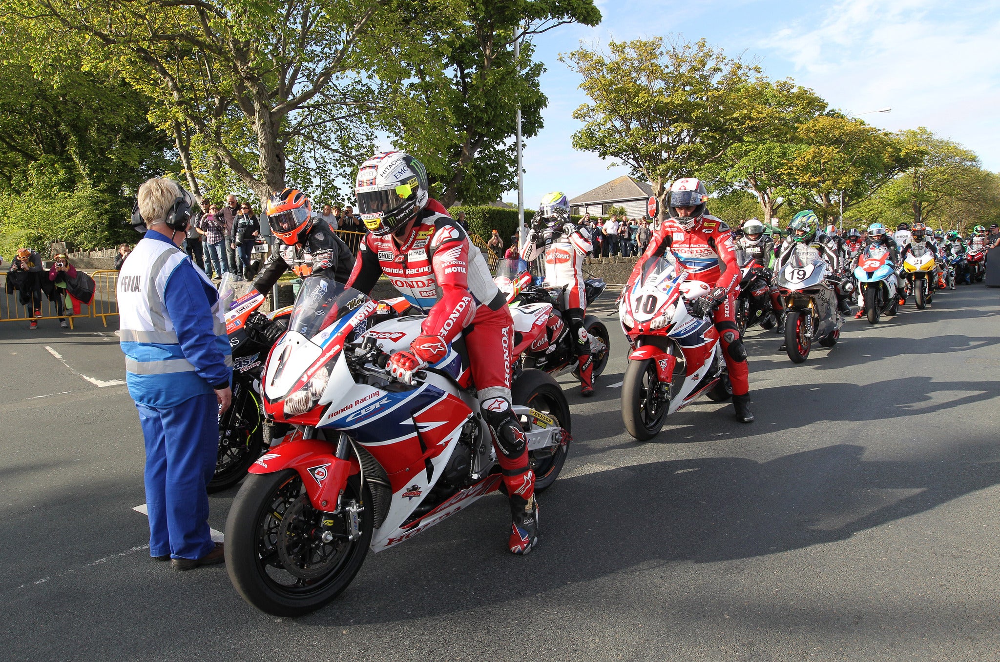 McGuinness (1) leads his Honda team-mate Conor Cummins (10) away during practice