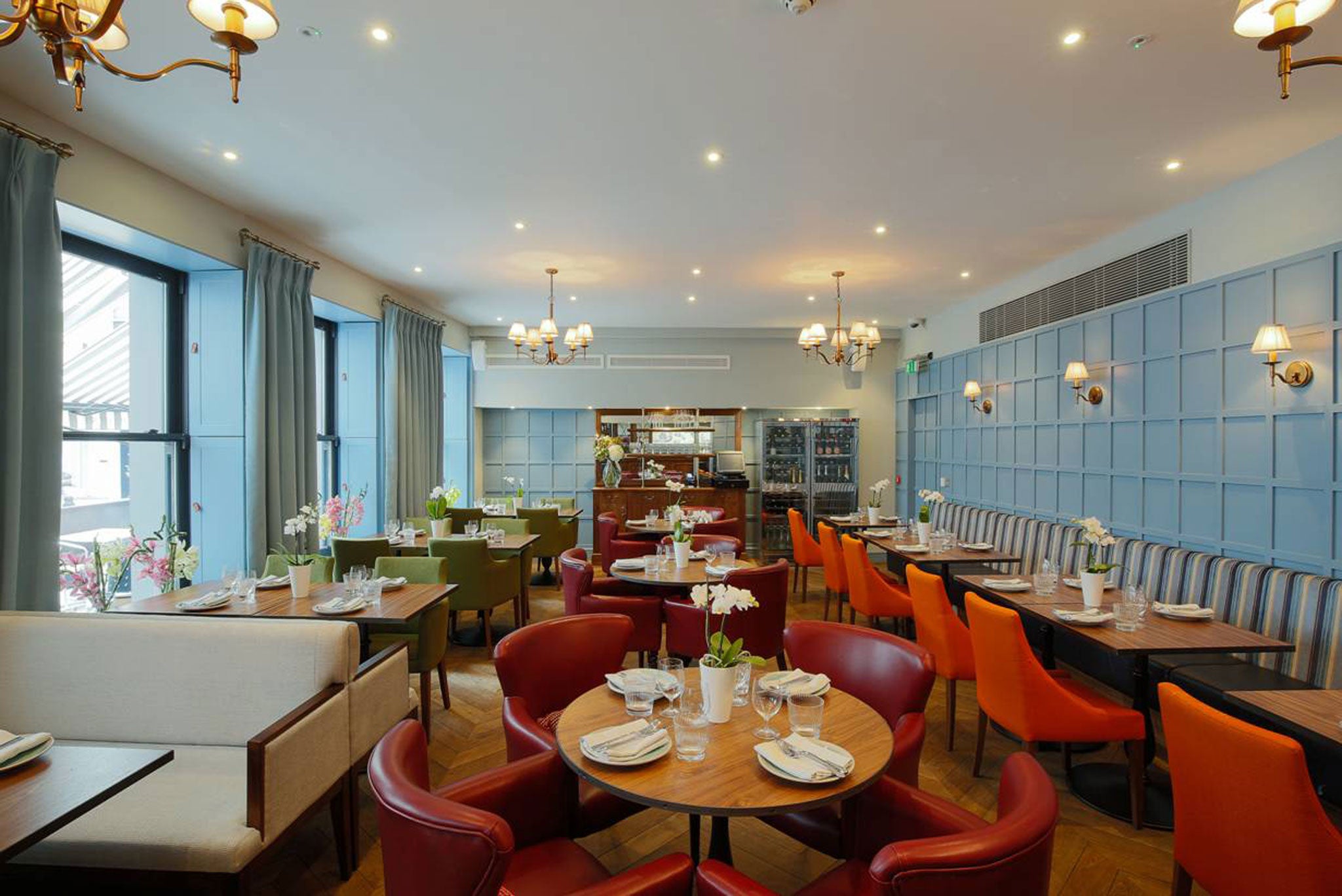 The all-white dining room of the St John era has been warmed up to look like a John Lewis 'Contemporary Dining' room set