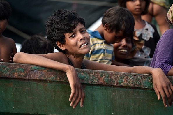 A young Rohingya boy pleads for water after being adrift on a vessel for three months