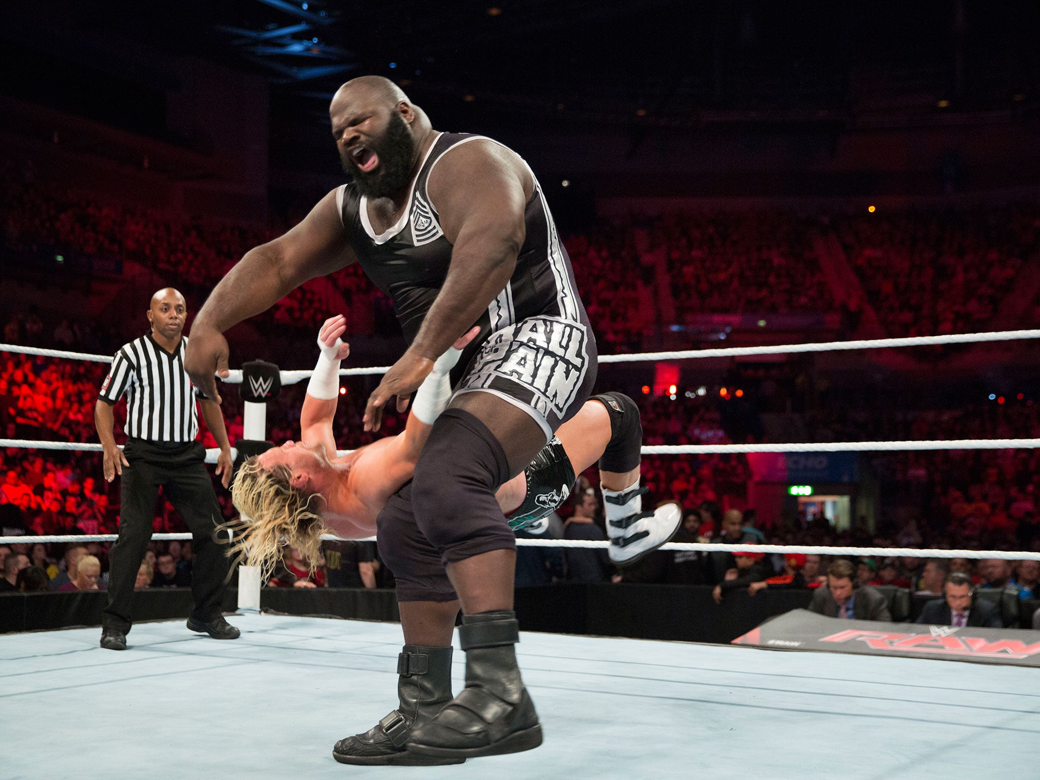 Henry delivers a clothesline to Dolph Ziggler