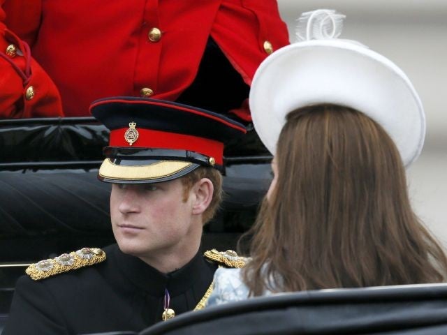 Prince Harry and Princess Catherine, the Duchess of Cambridge, return to Buckingham Palace after the parade