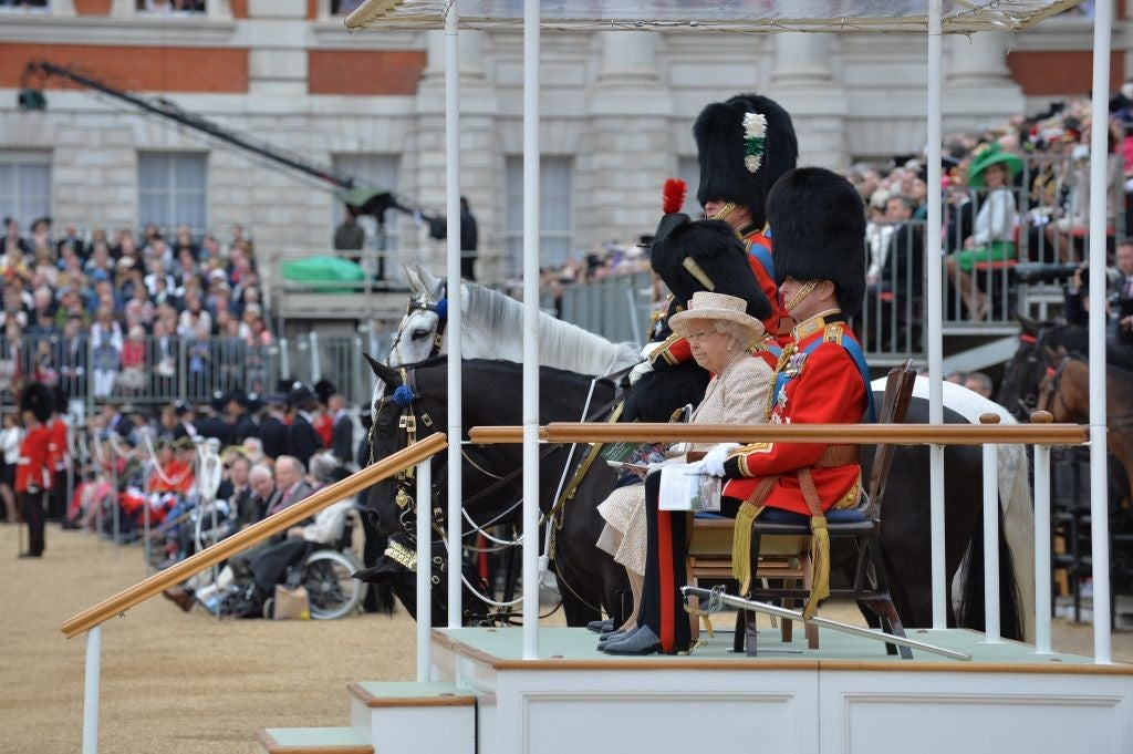 Queen Elizabeth II and Prince Phillip watch the Trooping the Colour parade at Horse Guard's Parade