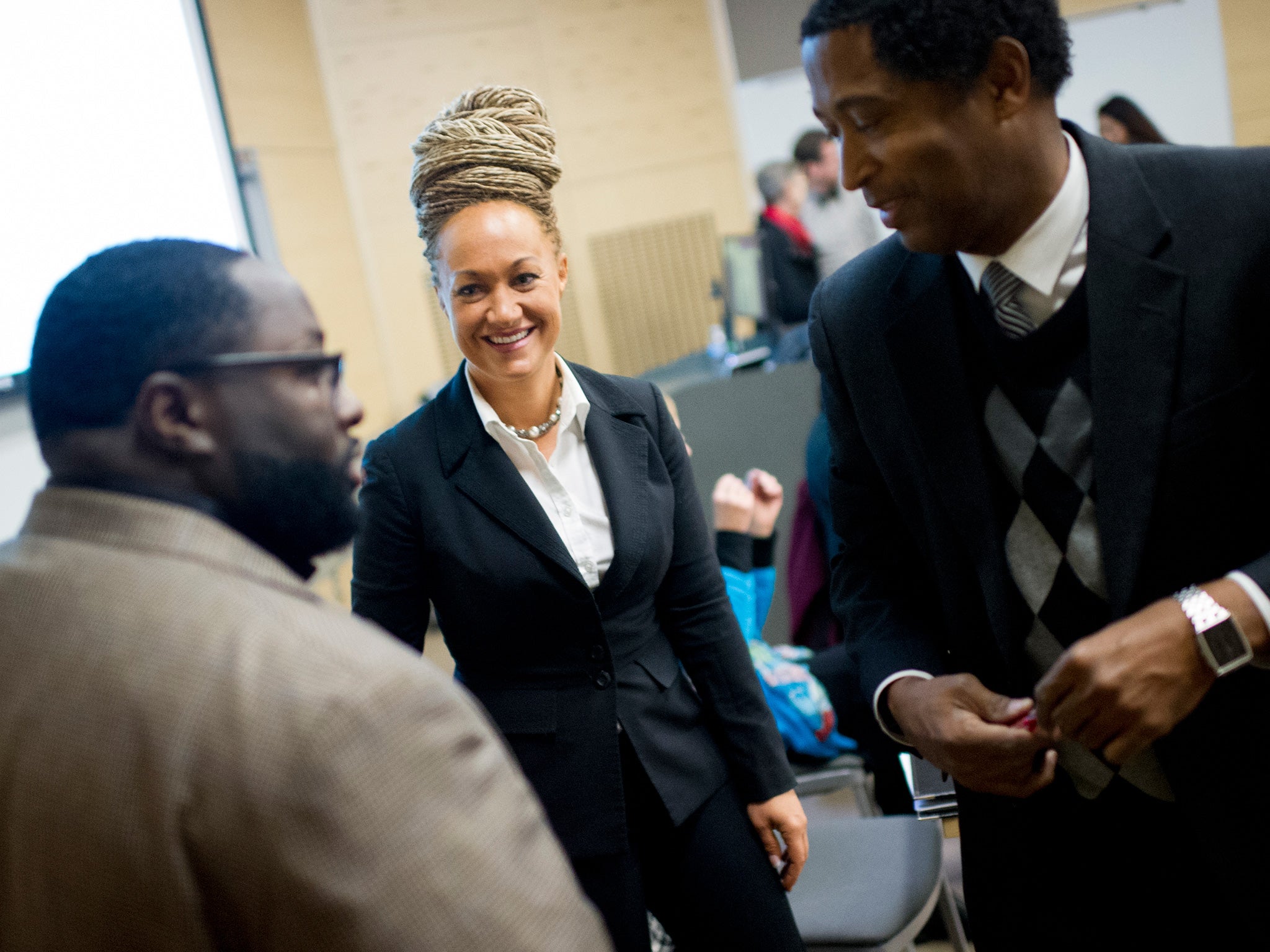 Rachel Dolezal (centre) was outed as Caucasian by her parents