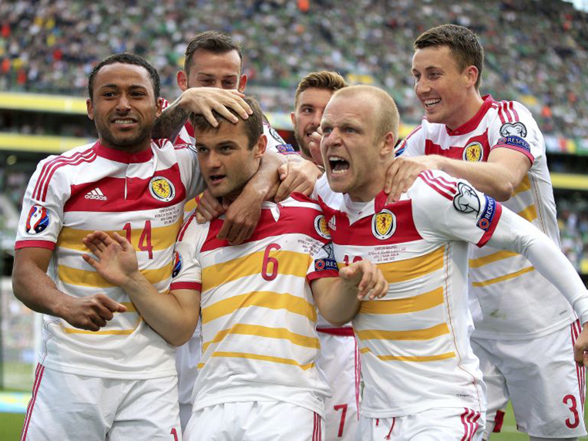 Shaun Maloney, centre, celebrates after scoring Scotland's equaliser on 46 minutes