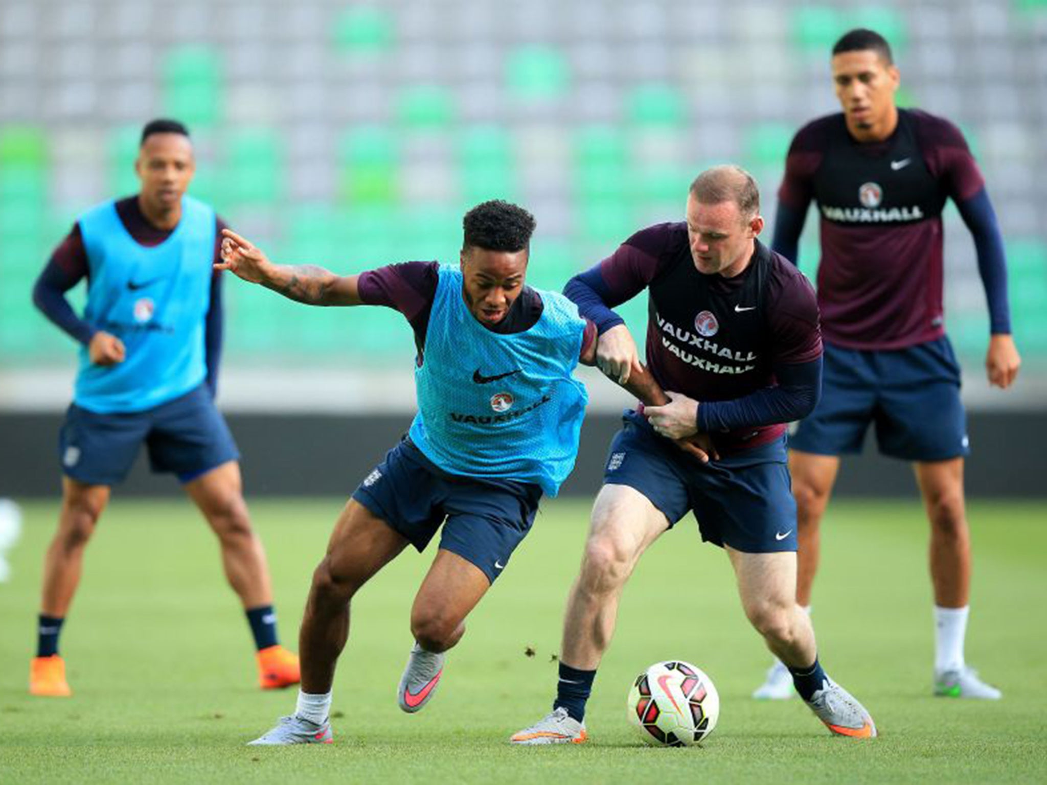 Raheem Sterling trains with Wayne Rooney