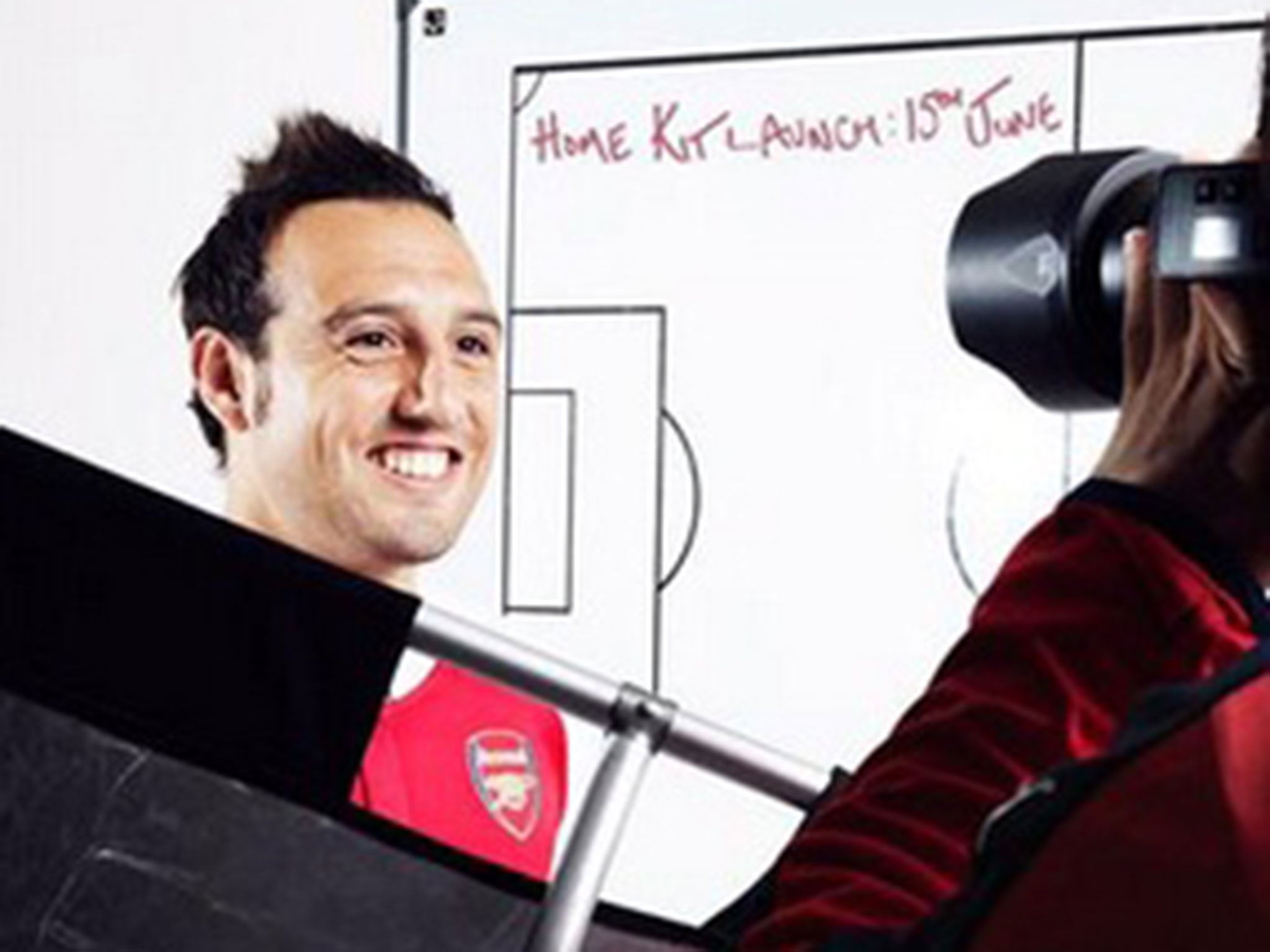 Santi Cazorla wearing the new Arsenal home shirt