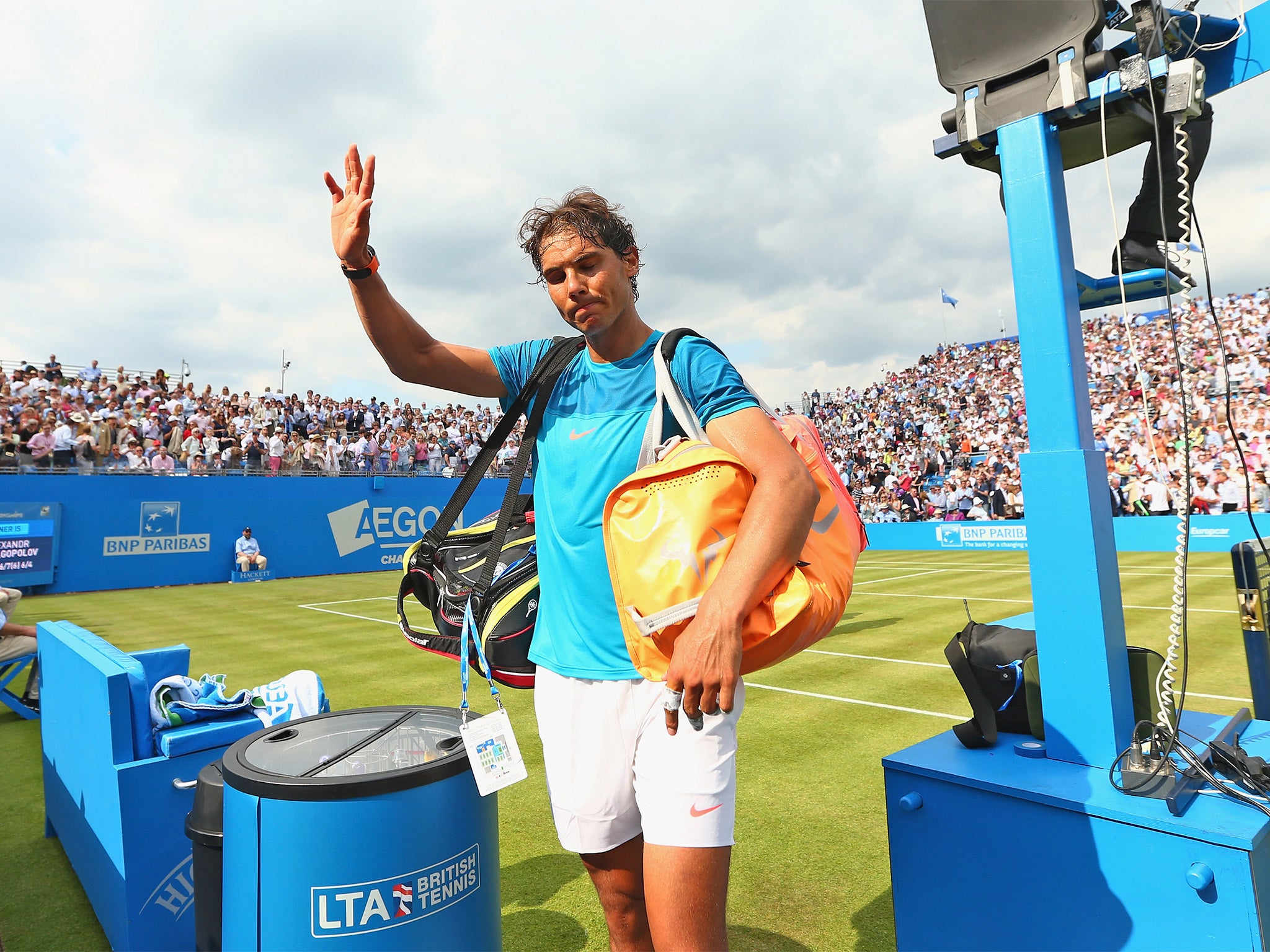 Rafael Nadal waves to the crowd at Queen’s Club after his first-round exit at the hands of unseeded Alexandr Dolgopolov (Getty)