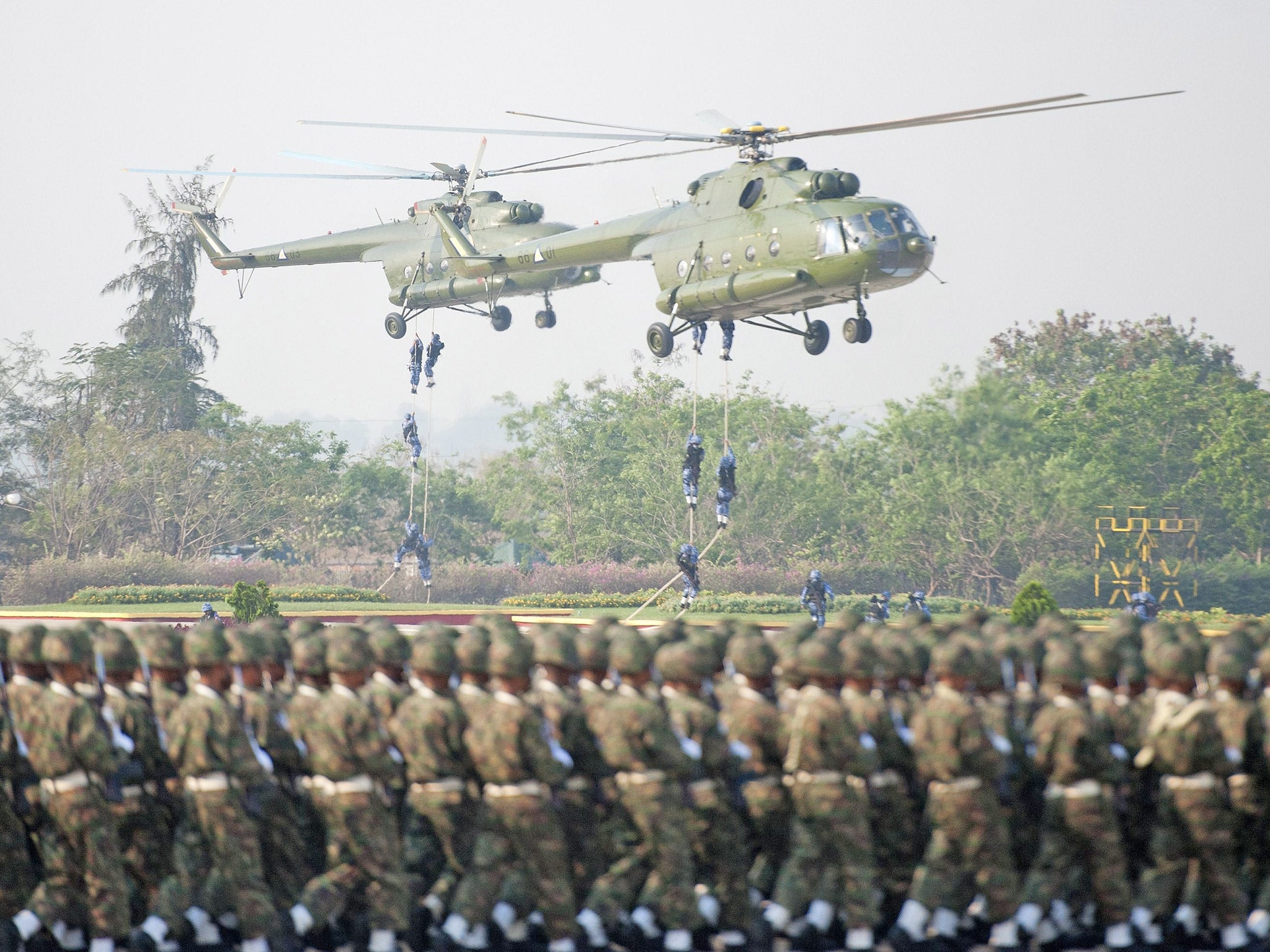 Navy Seals descend from a helicopter during a ceremony to mark the 70th anniversary of Armed Forces Day, in Naypyidaw, earlier this year (Getty)