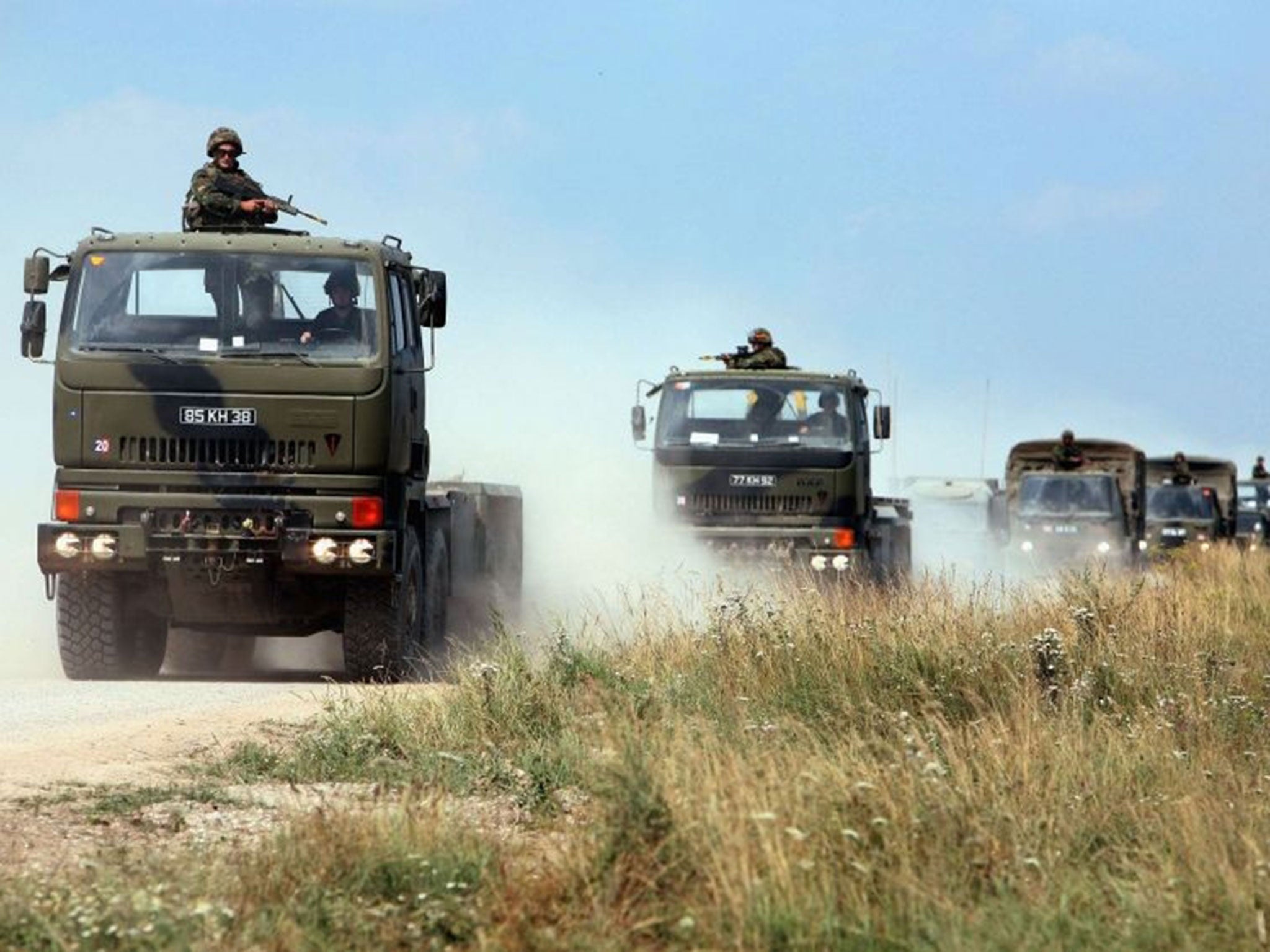 A convoy of vehicles arrive at Salisbury Plain, where 20 military personnel have been injured