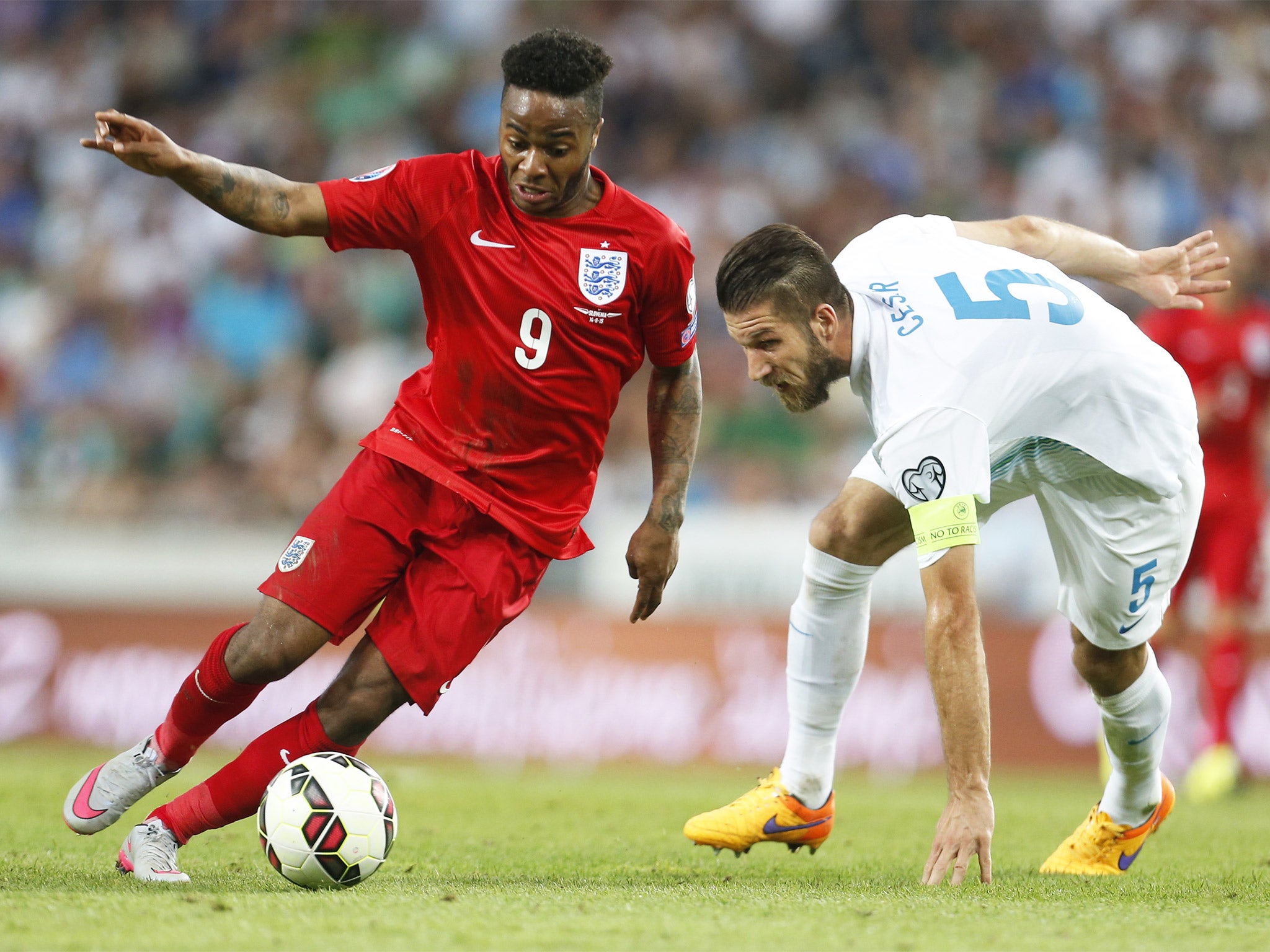 Raheem Sterling leaves Slovenia’s Bostjan Cesar in his wake during the Euro 2016 qualifier last Sunday