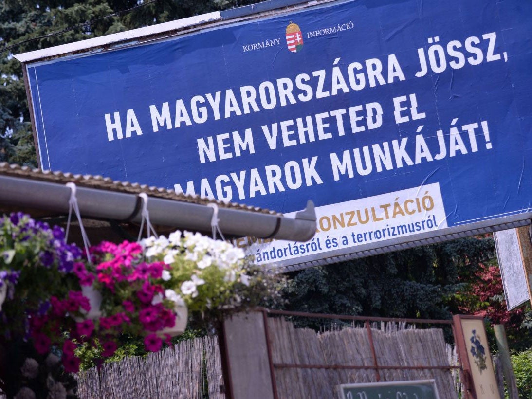 A state-funded anti-immigration poster in Budapest reading: 'If you come to Hungary, don't take Hungarians' jobs'