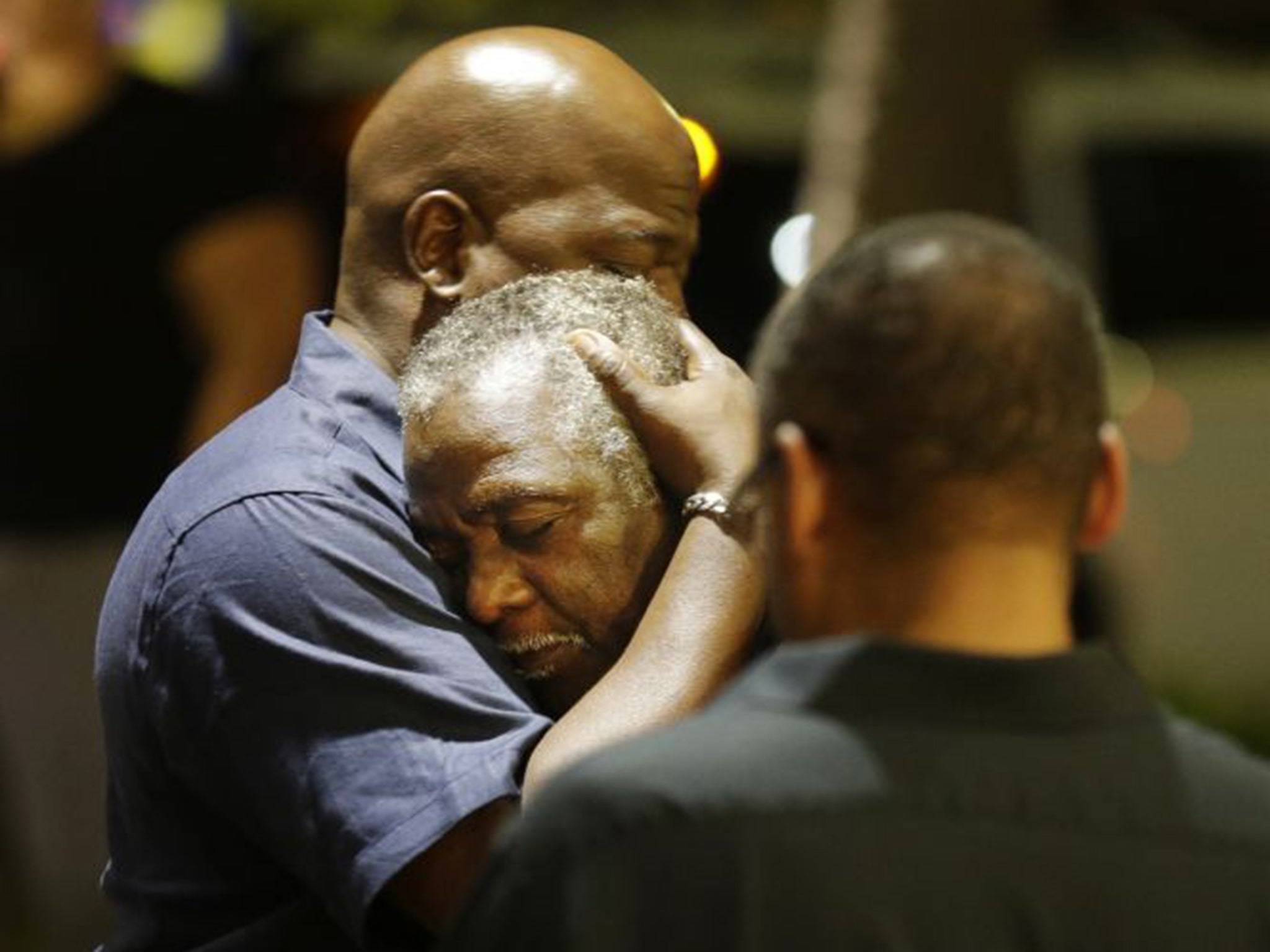 Worshippers in Charleston, South Carolina, across the street from Emanuel AME Church, where six women and three men were shot dead