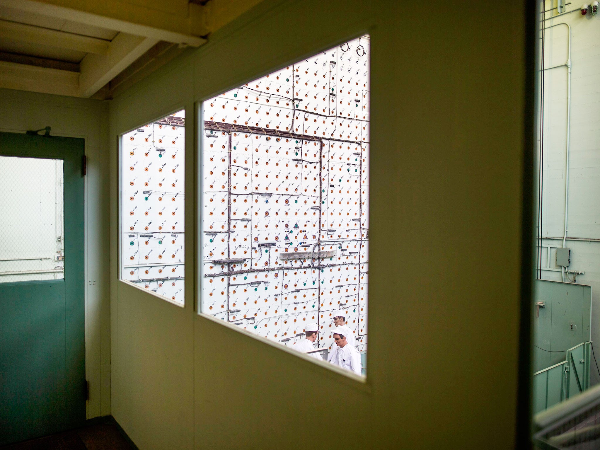 The loading face of the X-10 graphite reactor, the world's second reactor after Enrico Fermi's so-called Chicago Pile, is seen through the window of the control room at Oak Ridge National Laboratory in Oak Ridge, Tennessee