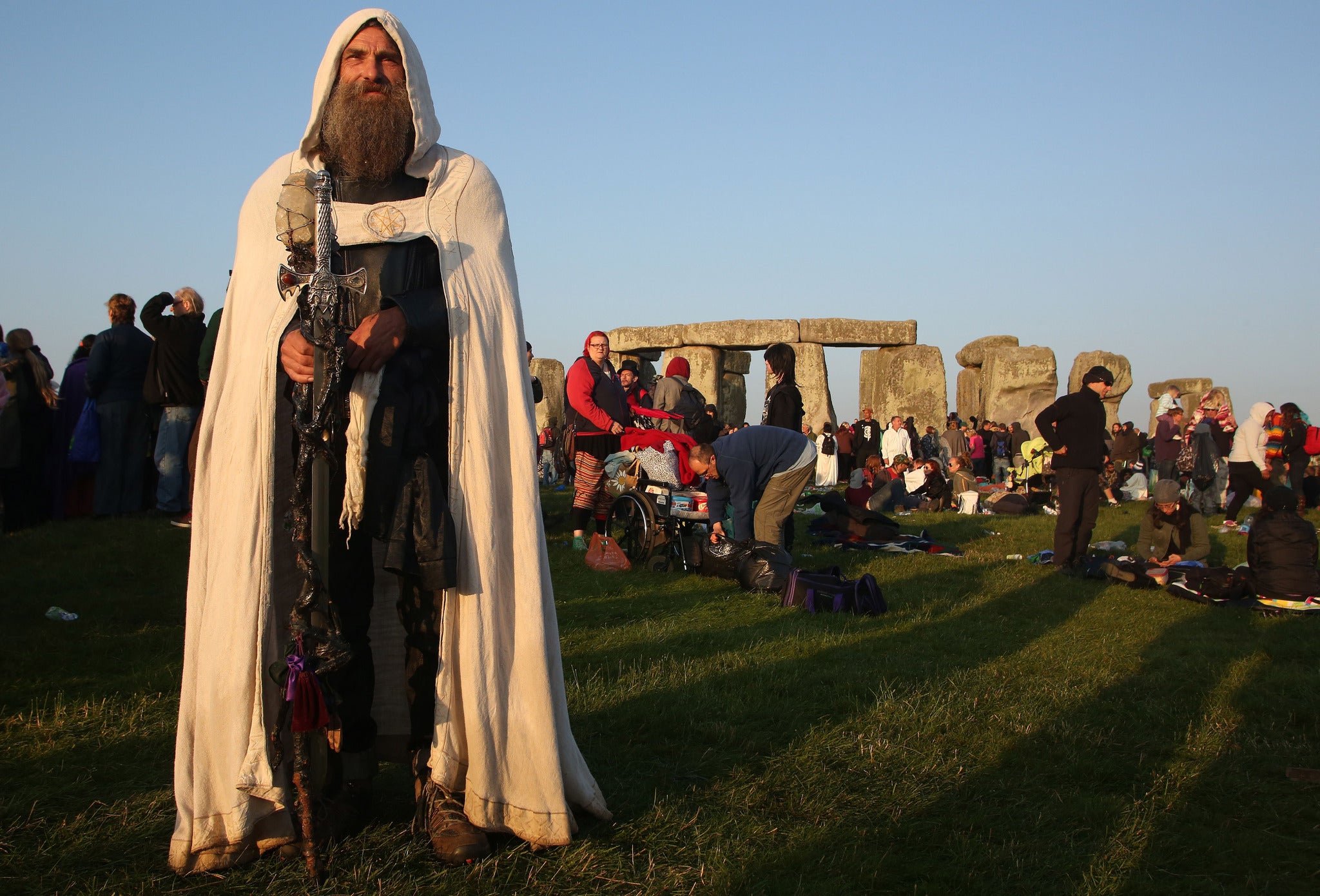 A Druid celebrates the summer solstice at Stonehenge