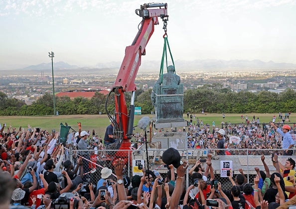 Students celebrated as the Cecil Rhodes statue was removed at the University of Cape Town in April 2015 - after almost a month of campaigning