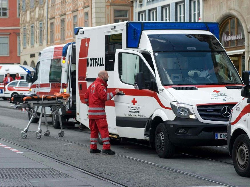 Paramedics at the scene where an SUV drove into pedestrians in the city center of Graz, Austria