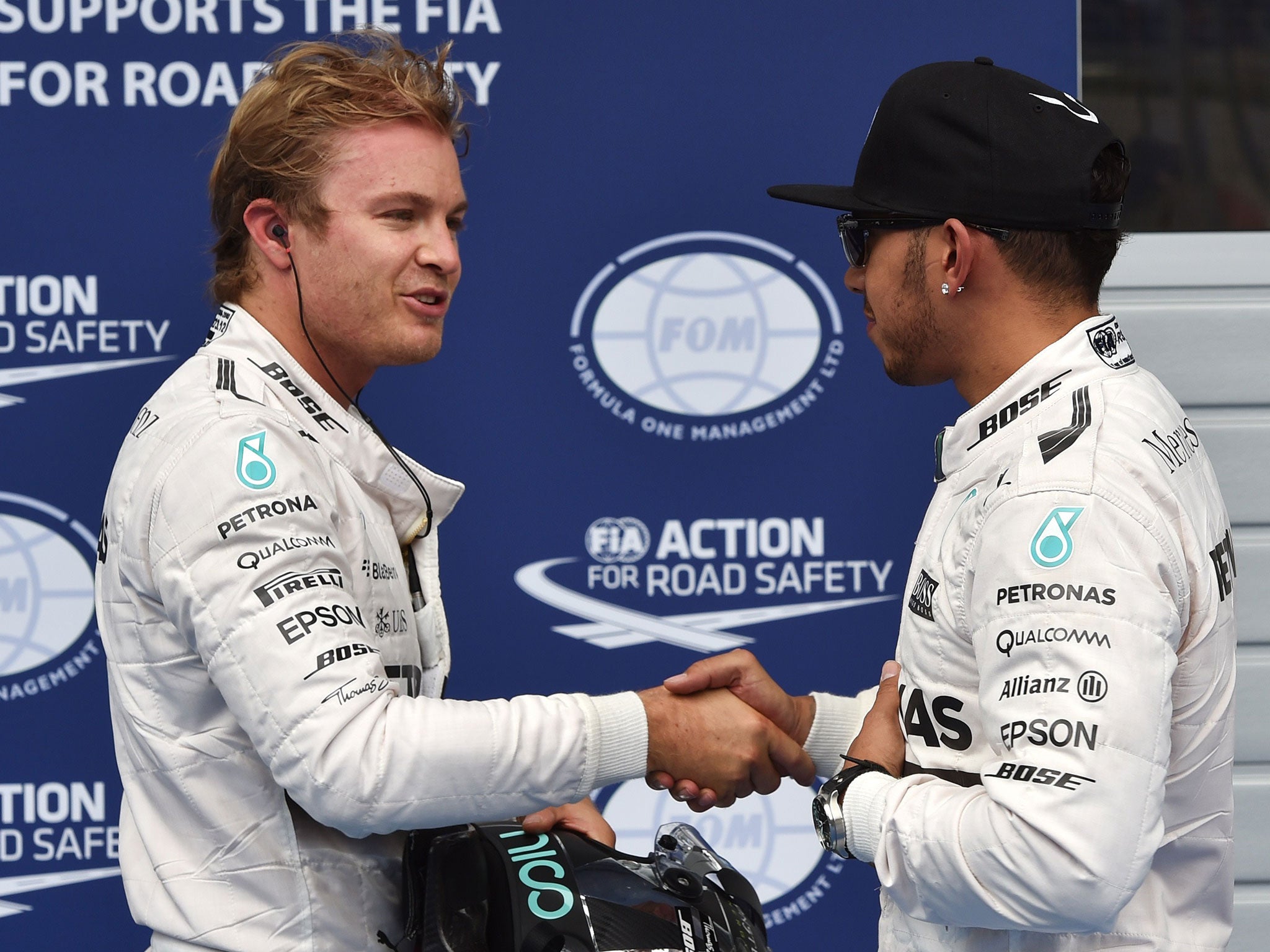 Mercedes team-mates Roberg and Hamilton shake hands after qualifying