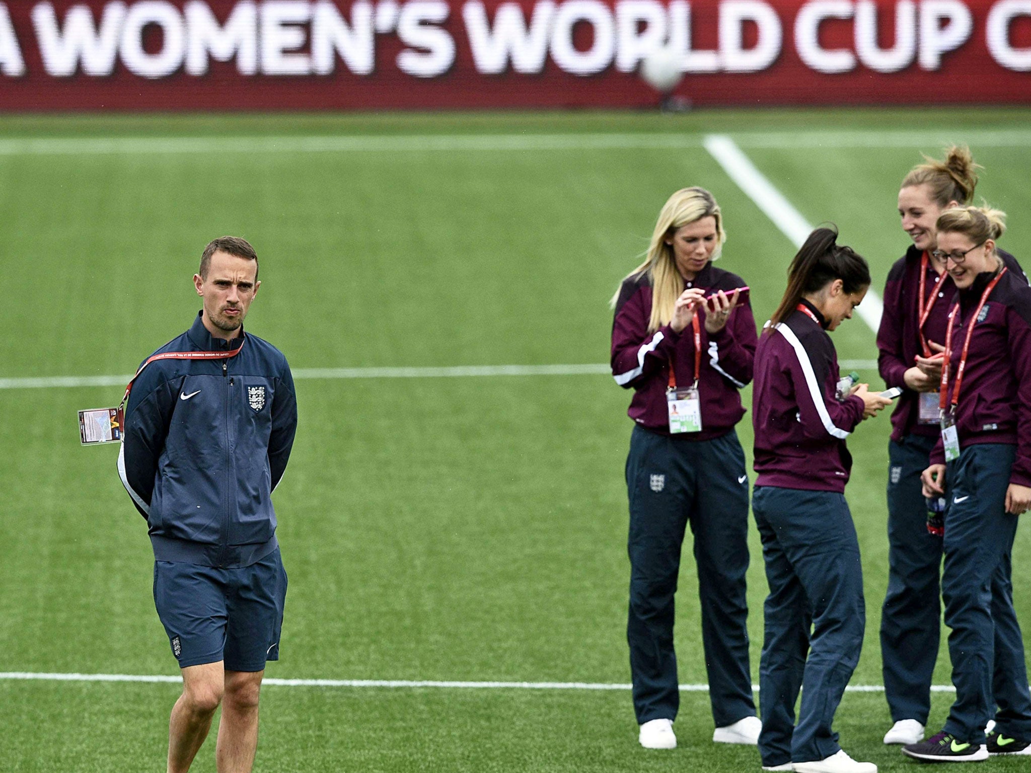 England coach Mark Sampson
with his team in training