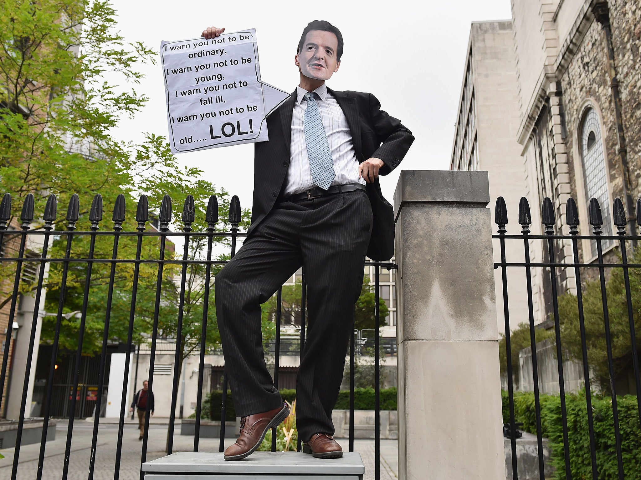 A protester dressed as British Chancellor of the Exchequer George Osborne poses during a demonstration against austerity and spending cuts on June 20, 2015 in London