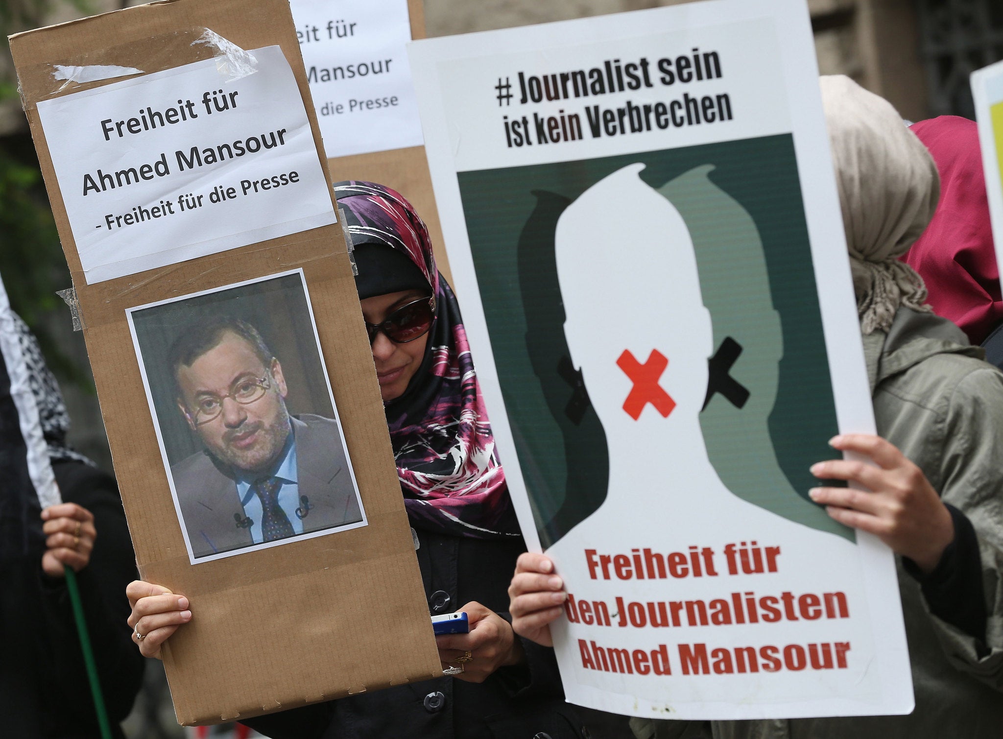 Demonstrators in Germany demanded the release of Al Jazeera journalist Ahmed Mansour