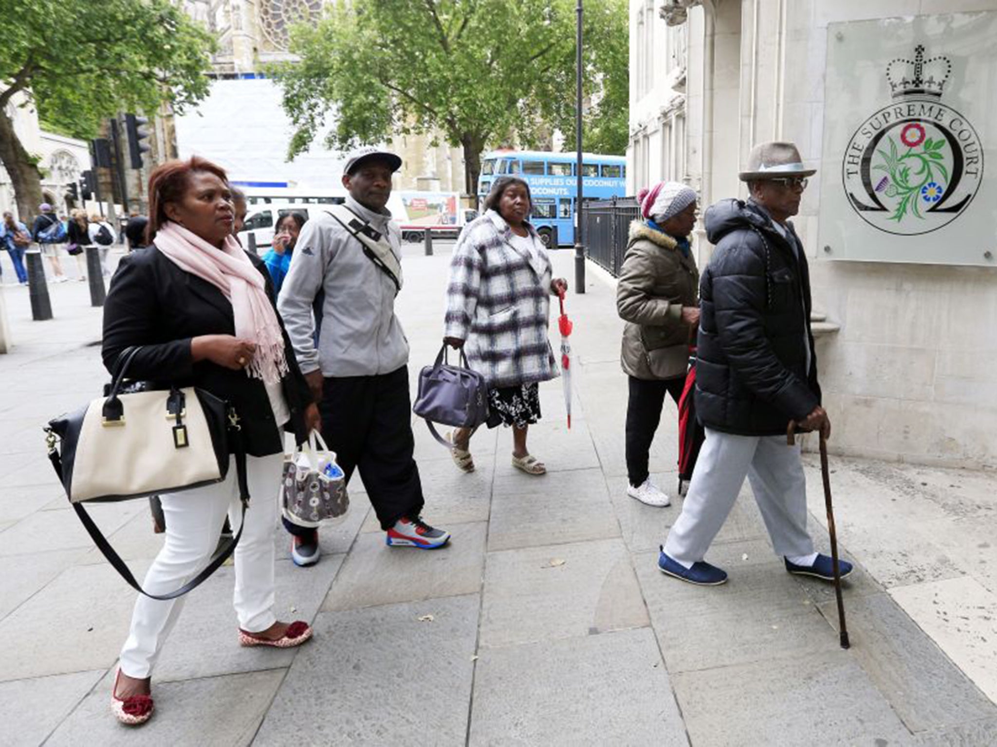 Former residents of the Chagos Islands arrive at the Supreme Court in London, preparing to challenge a decision made six years ago by the House of Lords which dashed their hopes of returning home