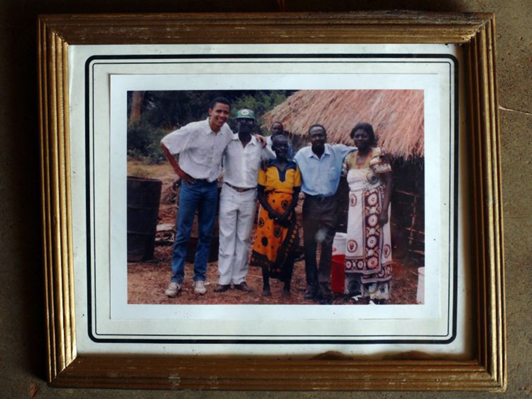 A photo of Barack Obama with family on her wall in Kogelo, taken during a visit in 2006, when he was still a senator