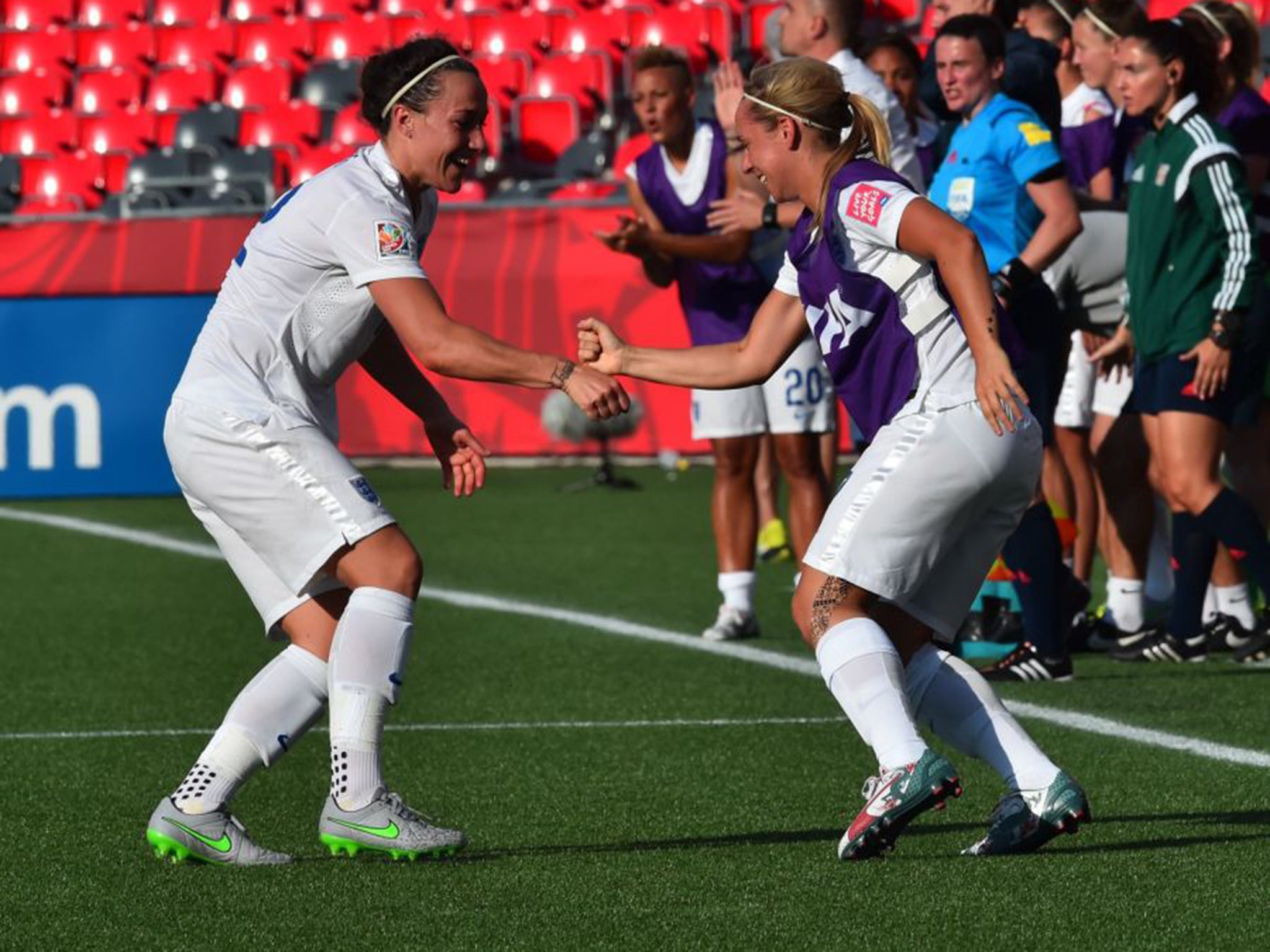 Lucy Bronze, left, celebrates with Jordan Nobbs after scoring England's second (and ultimately decisive) goal (Getty)