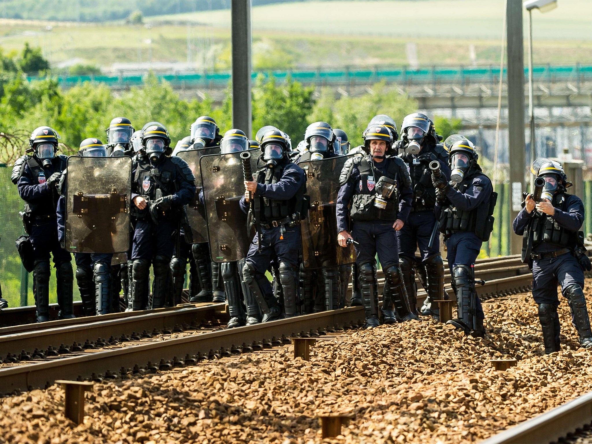 French riot police take position to drive out protesters blocking the railway tracks (Getty)