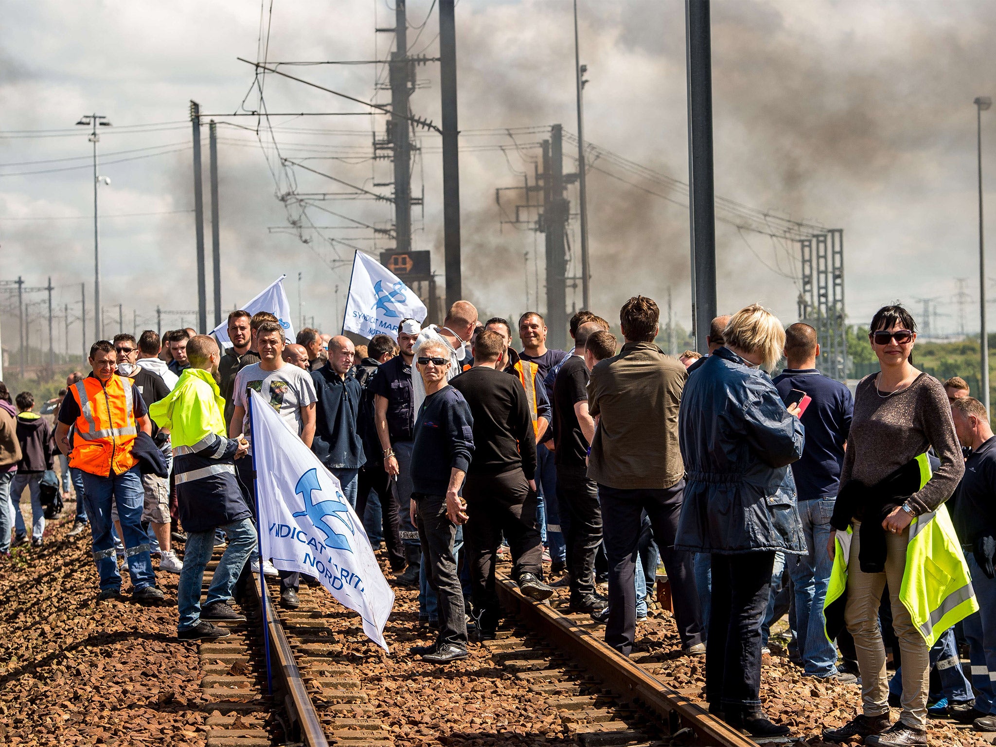 Protesting French employees of the company English Channel passenger and freight ferry company "MyFerryLink" block the railway tracks of the Eurostar Channel tunnel line in Calais (Getty)