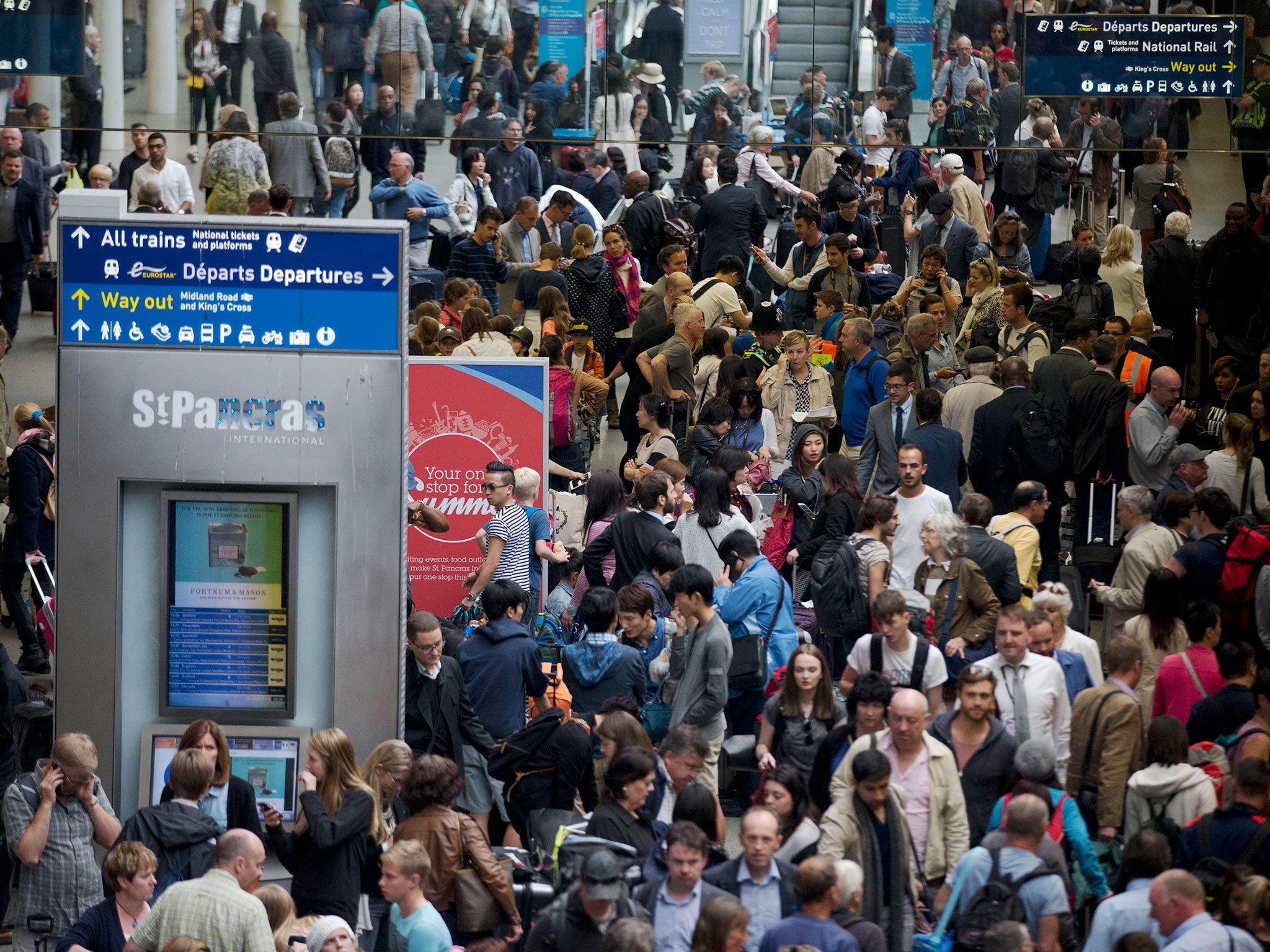 Passengers stranded by the cancellation of Eurostar trains wait at St. Pancras station in Londonarmed the train line setting tires alight