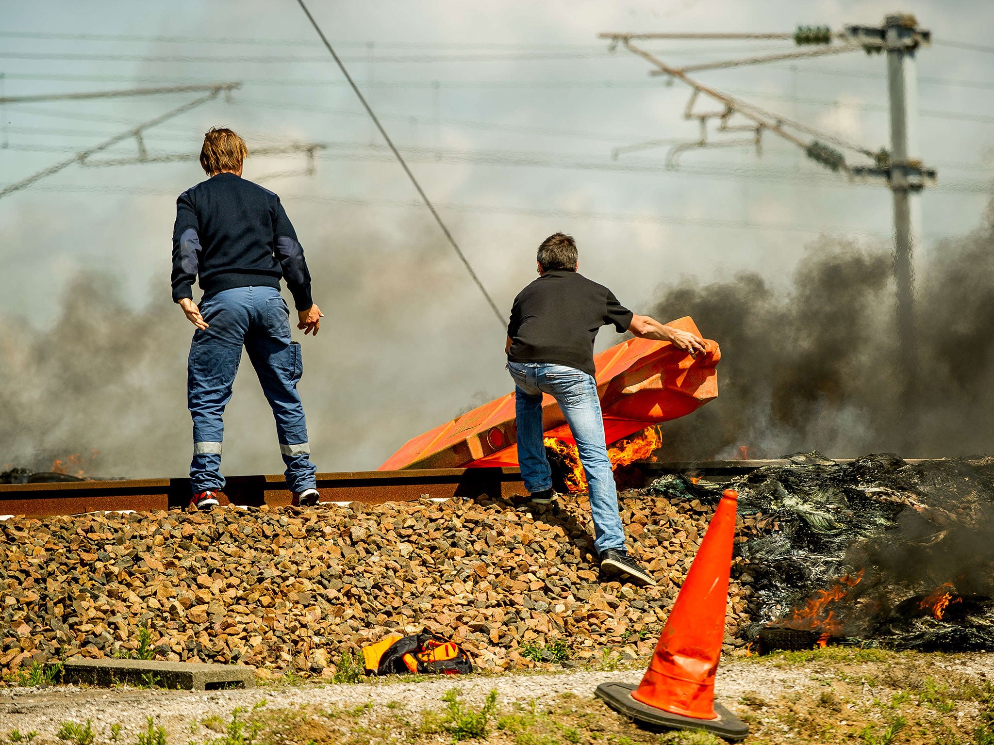 MyFerryLink staff block Eurostar tracks with a burning plastic barrier