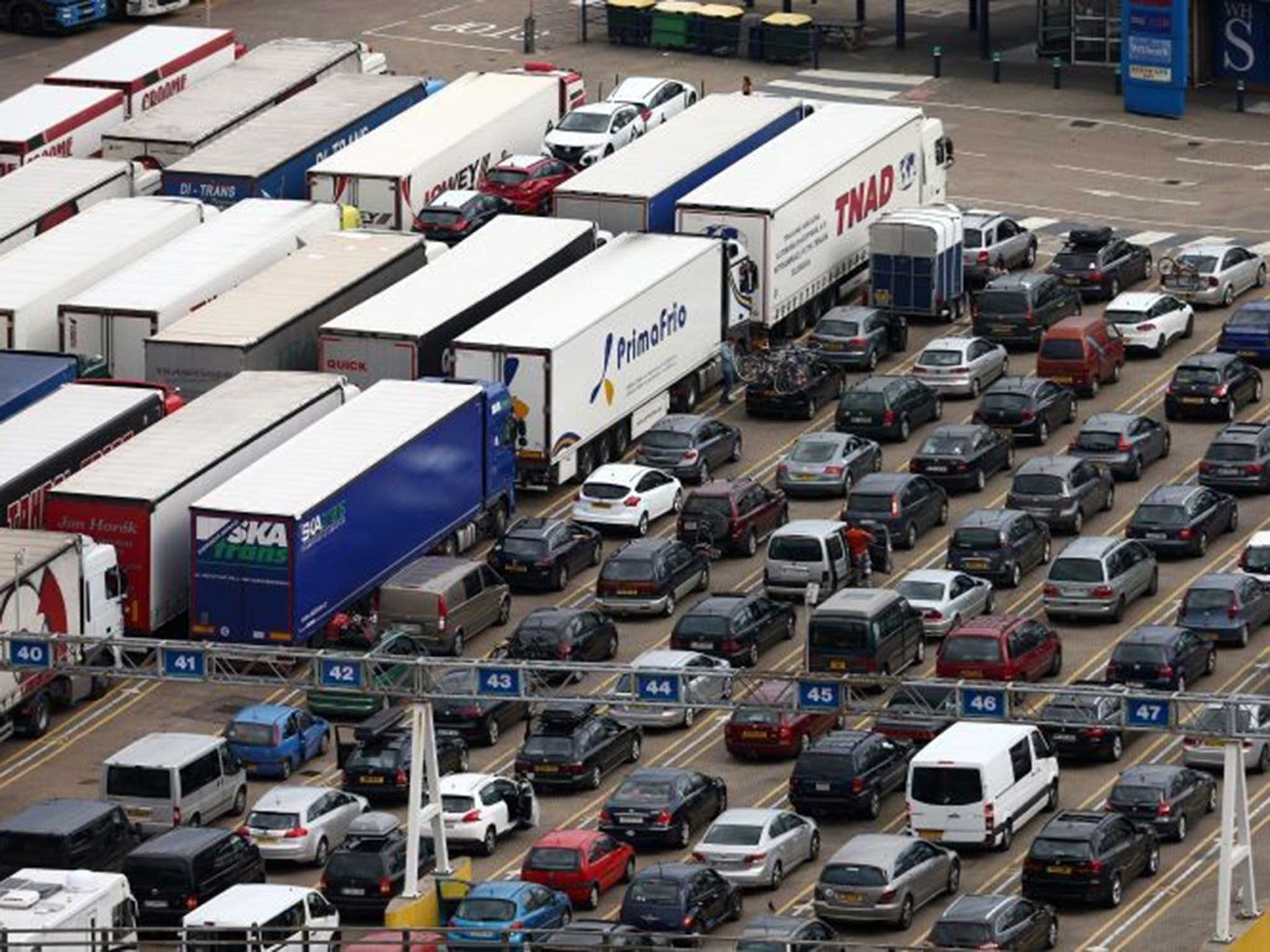 Cars and lorries queue to board a ferry