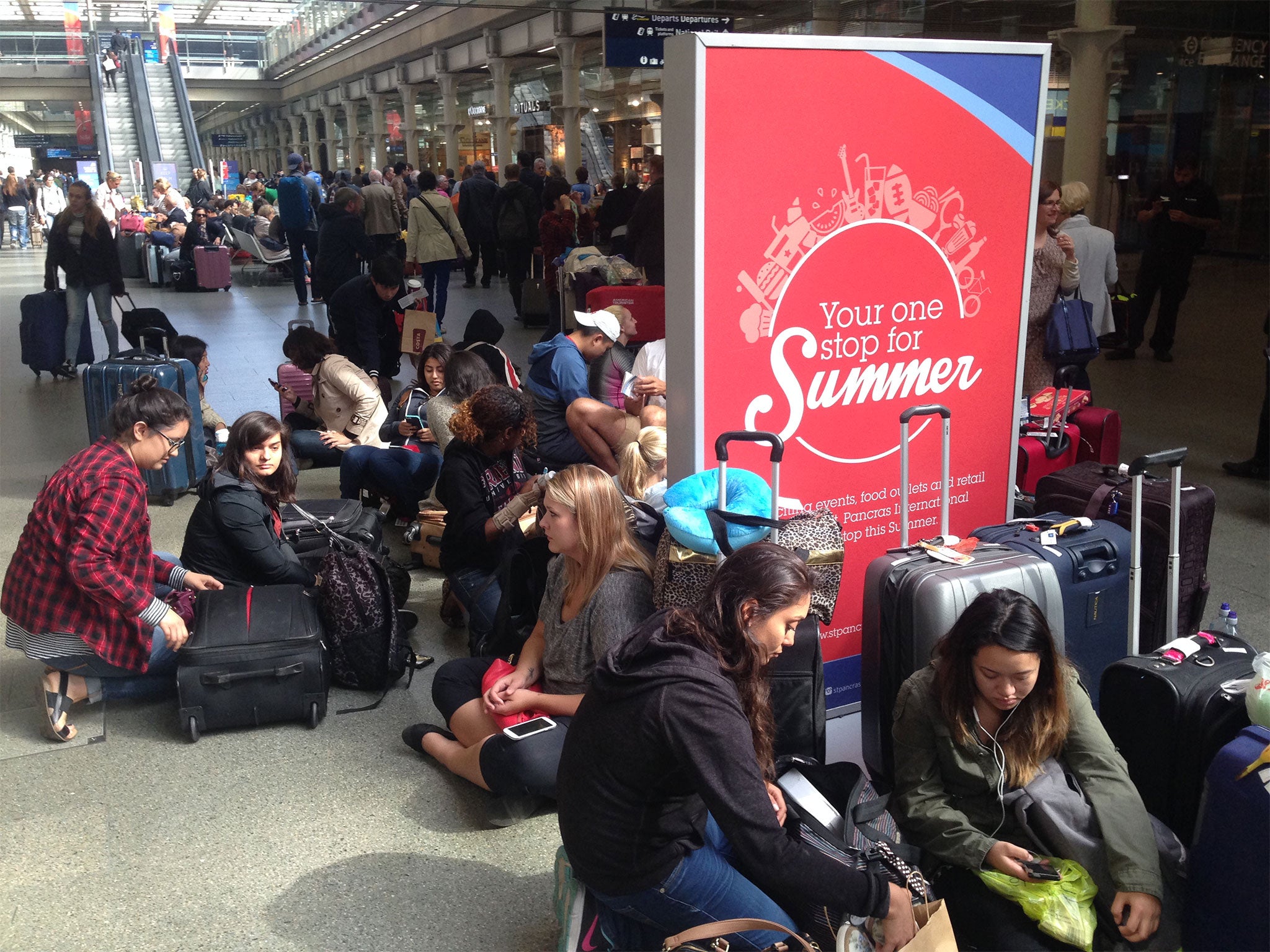 Passengers waiting for Eurostar trains at London's St Pancras station