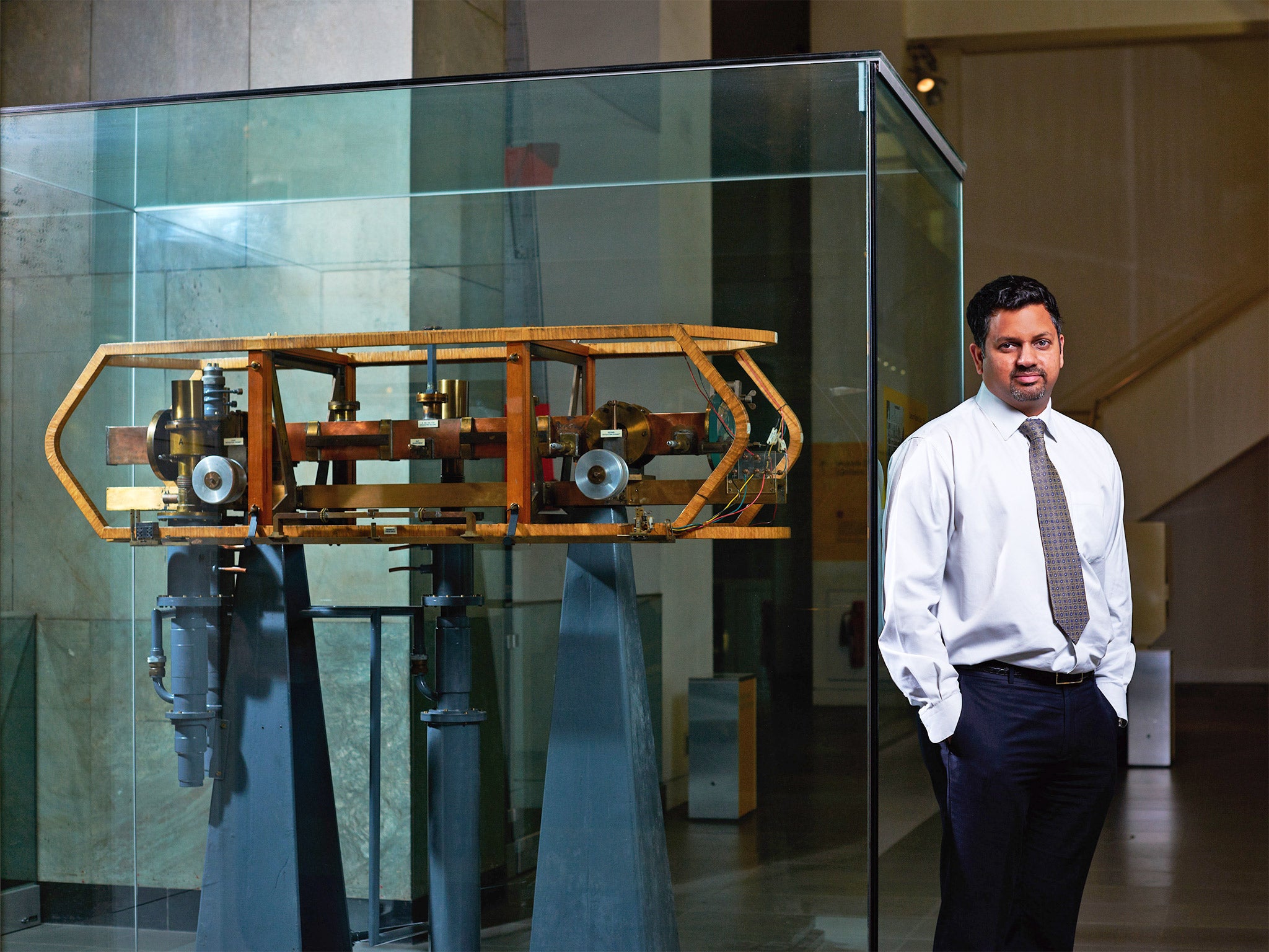 Time lord: Dr Leon Lobo at the NPL lab with Caesium I, a time machine built in 1955