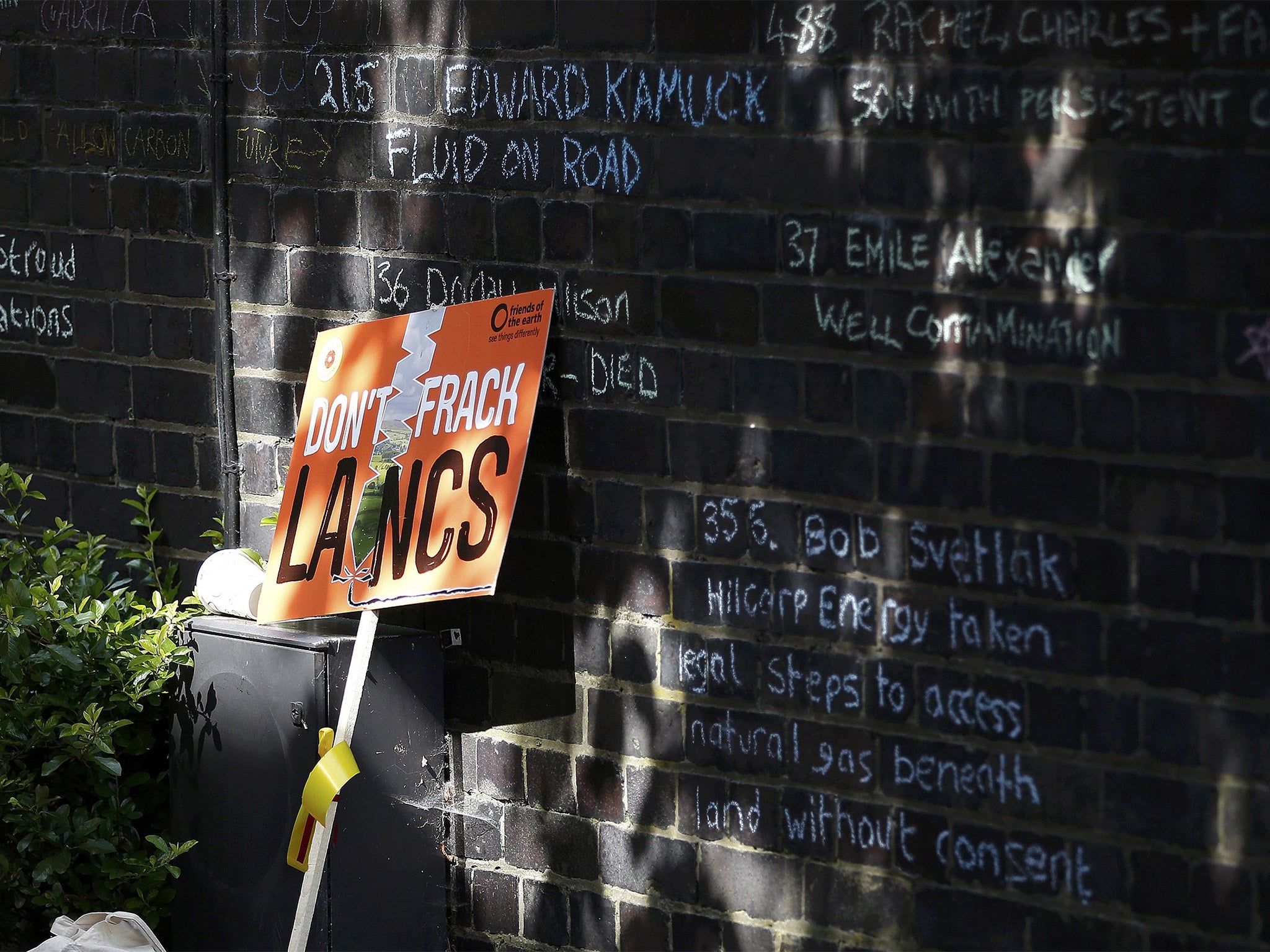 Messages written by anti-fracking protesters on a wall near County Hall in Preston