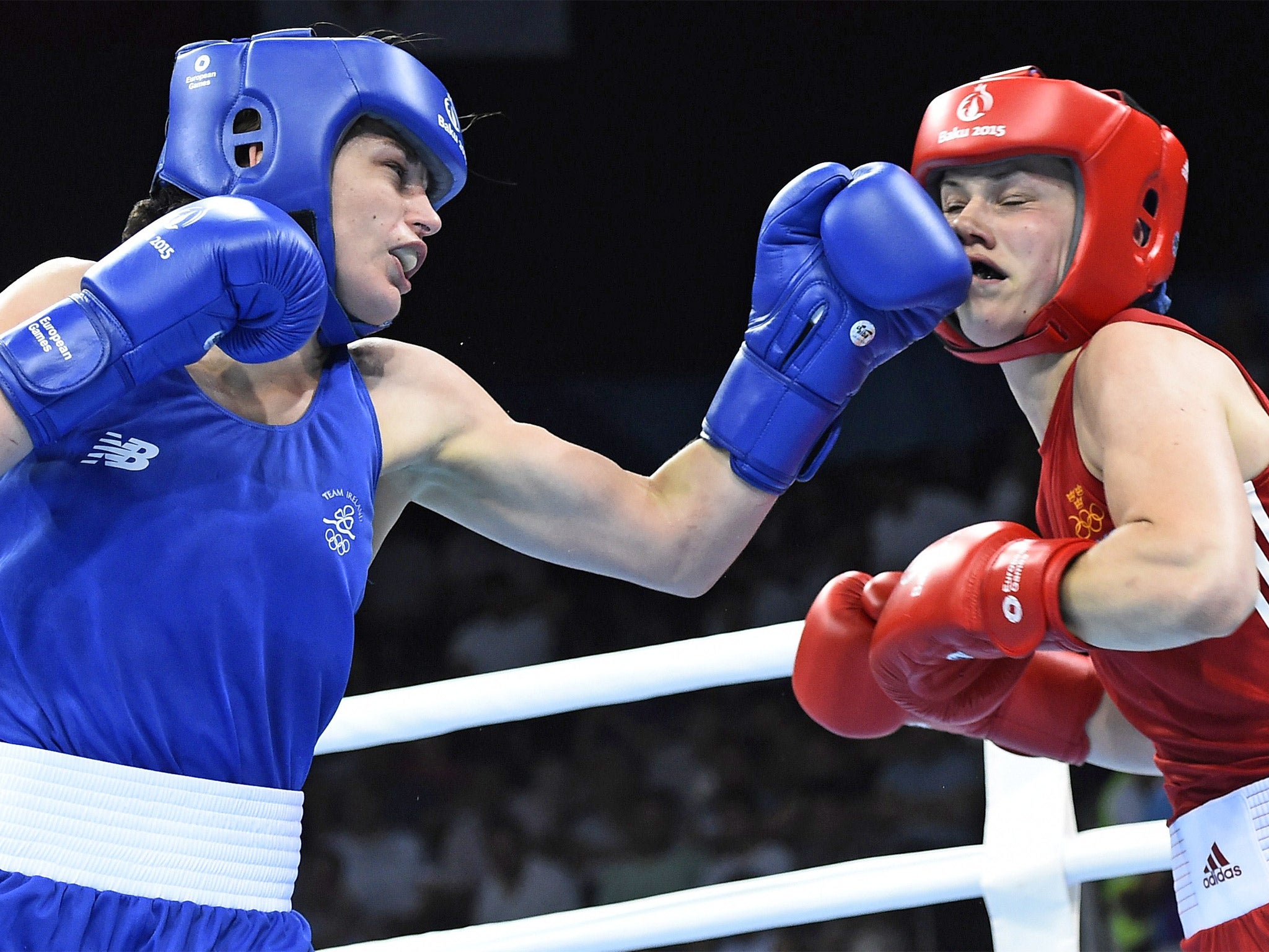 Katie Taylor lands a left hand on her opponent's face during her quarter-final victory